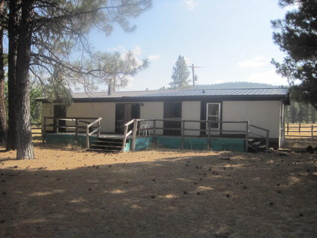 Nice Secluded home that sits in the middle of the acreage giving you a private serene setting. Beautiful views of the Mountains and Trees. Nice gated entry to the home to give you more privacy. Property is fenced. Some outbuildings.  The home is being sold As Is condition. Needs a little TLC. Just outside of Sprague River, Level 20.24 acres. Sellers have little knowledge of this property. Buyers to do their own Due Diligence.