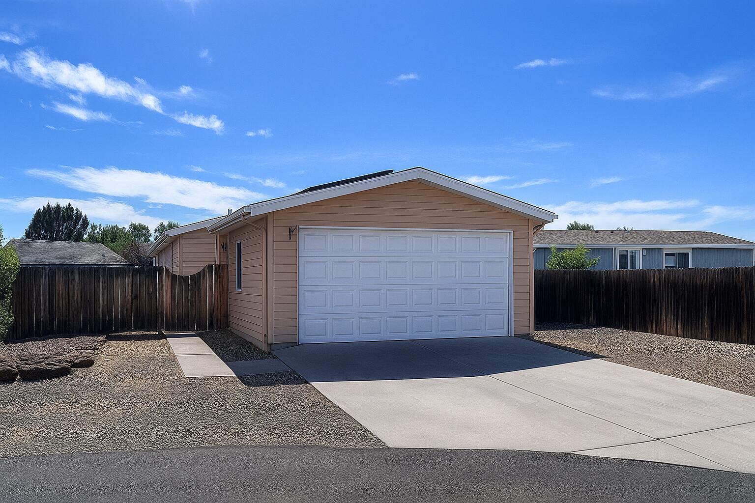 Manufactured home in Redmond's Desert Meadows neighborhood. Located on a cul-de-sac with a large, fully fenced lot, detached 2 car garage and extra parking for trailer/RV. This 1,107 sq ft home features vaulted ceilings, an open living space, and newer vinyl floors. Solar has been installed. Home needs TLC and sale is subject to trustee review. Call your realtor for more information.