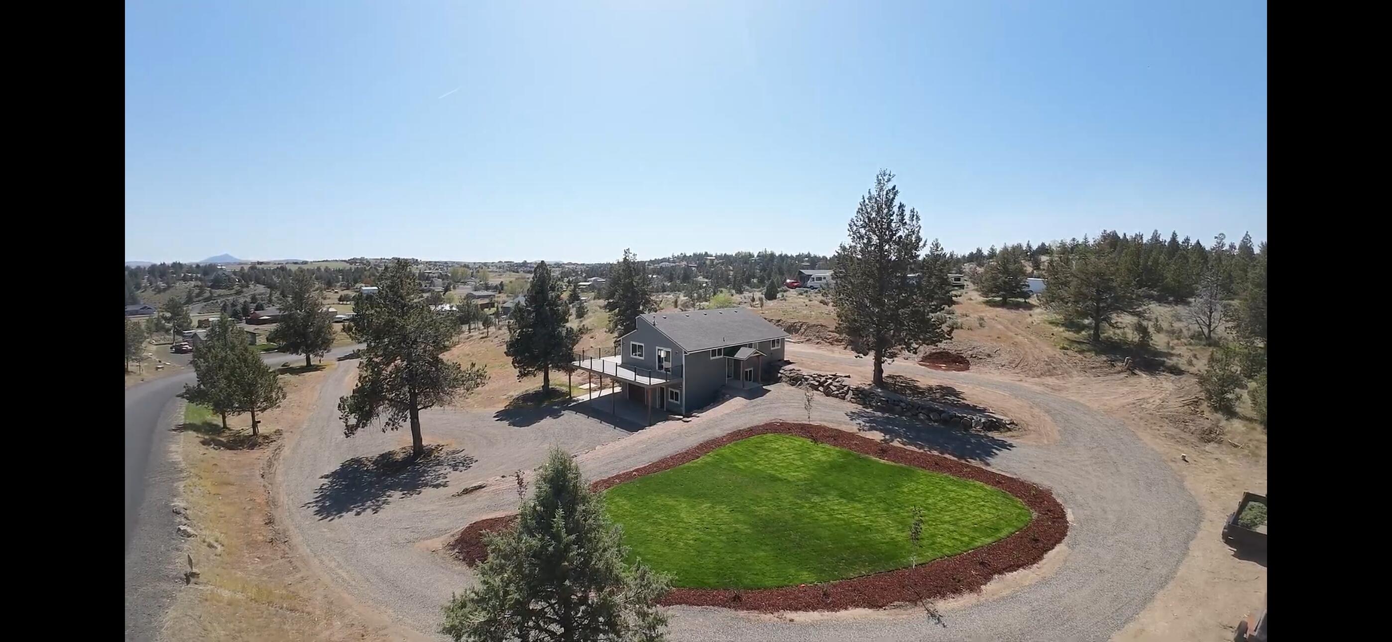 This beautiful 1974 sqft home with a wrap around deck provides quiet and tranquility to enjoy the amazing views. This 4 bedroom,  two bath home has been completely remodeled from a new roof, new windows, new siding, new deck, new paint inside and out, new flooring, new kitchen with granite countertops, new bathrooms, new lighting, new appliances, new septic. and new landscaping.  It also has an office space downstairs. Someone will get an almost new home with all the space for your toys. It's a must see to appreciate the work.