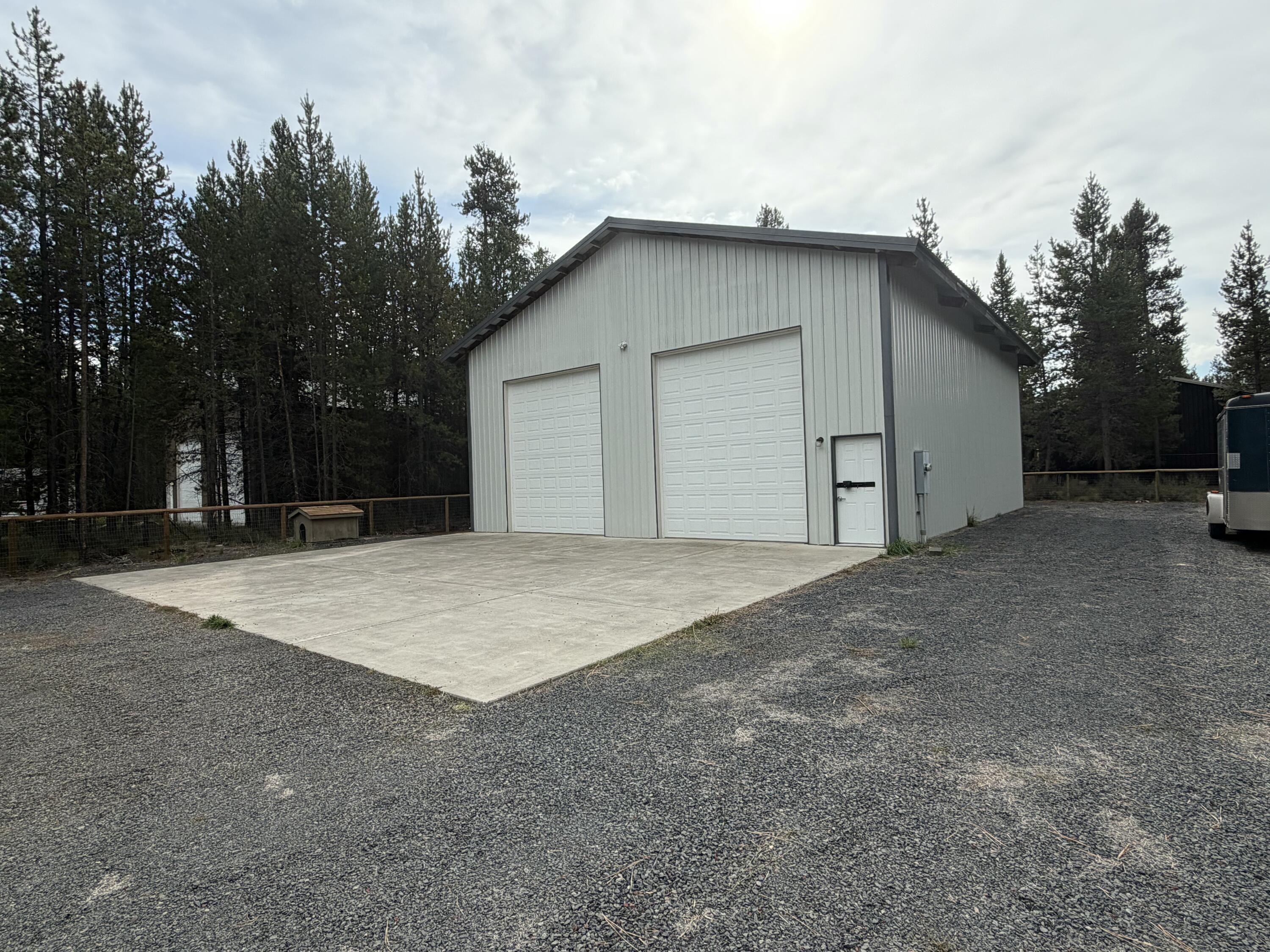 Looking for a .57 acre lot with a 40 x 48 shop fenced with wrap around gravel driveway with double gates for easy access. This shop has a 25 x 40 concrete entry pad with 1- 10 x 14 RV doors and a man door, concrete floor, insulated and plywood sheeted painted white to give you a bright work area, this comes with a auto lift, air compressor and high end LED lights, This property also has a well, heat, huge overhead fan, mezzanine and the 40 ft Conex storage container all included. This is a great opportunity for a storage shop and work shop. This is ready to start your new adventures.