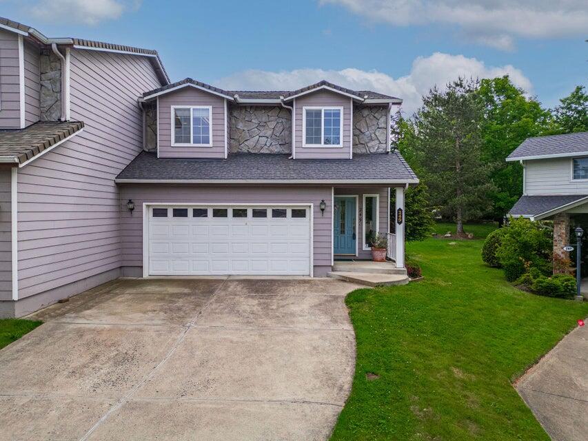 Welcome to this well-maintained and lovingly cared for 3 bed, 2.5 bath townhome with 1,555 sq ft of comfortable living space.  Nestled near charming downtown Ashland, this home offers the perfect blend of convenience and tranquility. Inside, you'll find a spacious kitchen with ample storage and a a large pantry--ideal for any home chef. The cozy living room features a welcoming fireplace, perfect for entertaining guests or relaxing with family. Enjoy large bedrooms, custom cabinetry in both full bathrooms, walk-in showers, and closet. The large laundry area is located upstairs. The low-maintenance backyard is ideal for easy living and the HOA takes care of the front landscaping.  Situated at the quiet end of the road with a peaceful creek view- this home is a true gen.