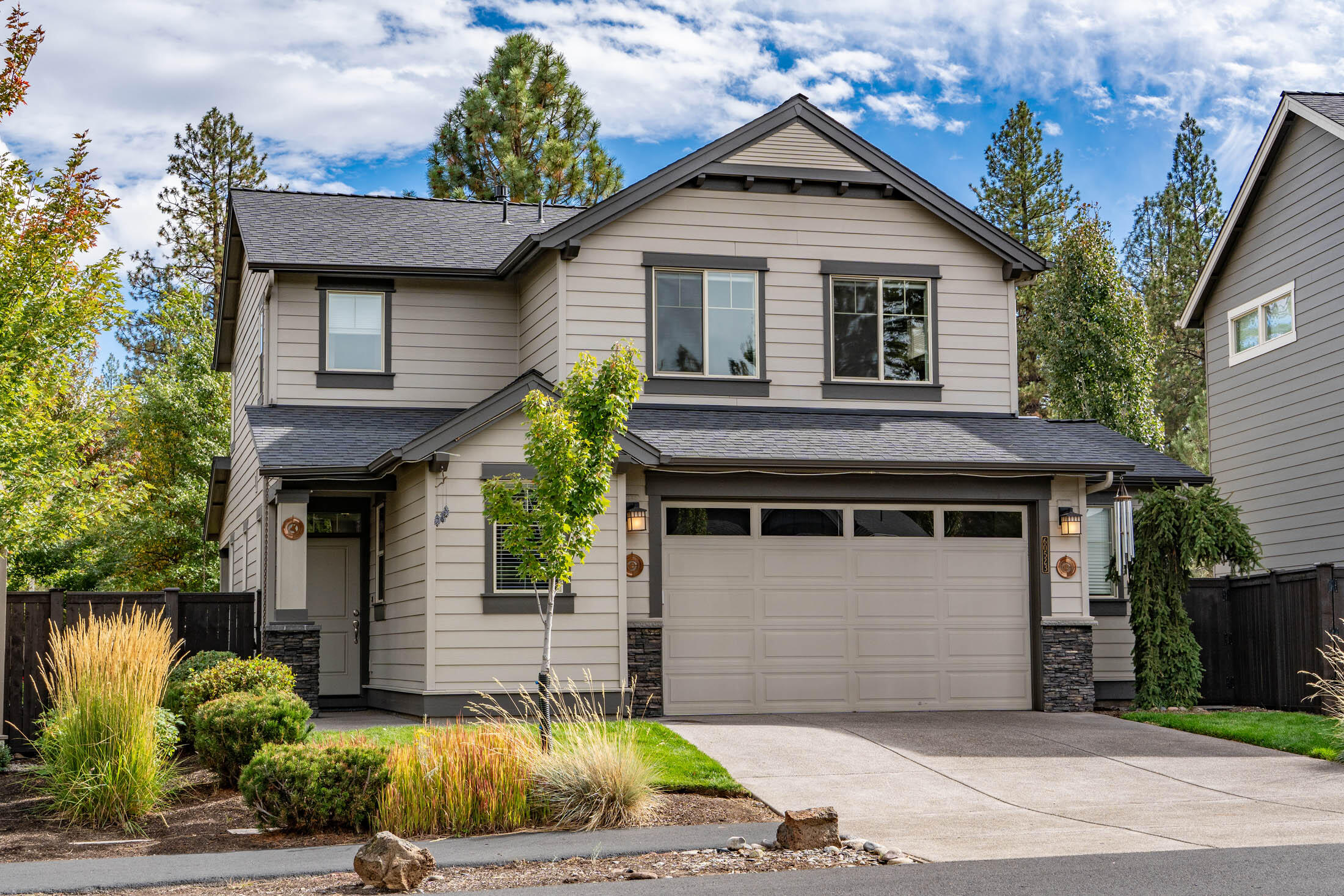 Located in the popular Stonegate community, this move-in-ready home offers the best of both worlds...like-new condition without the wait & limits of new construction. Very well maintained,  you'll find bright & open living spaces, quality finishes & modern features. Enjoy a comfortable layout with walls of windows - looking onto nature! A dedicated dining space on the back of the home provides an intimate setting for gatherings. Heart-of-the home kitchen has quartz countertops, full-height tiled backsplash, newer refrigerator & large island. Lux-sized primary suite allows for lounging, large WIC, very well appointed and spacious bath.  Entertain, run and play through all the seasons from a large covered patio and your private, fully-fenced yard. Relish low maintenance, mature landscaping from day one! True oversized 2-car garage allows for a gym/workshop. Choose Stonegate and be part of a storied,& fabulous community with a private pool, hot tub, clubhouse, walking trails & playground