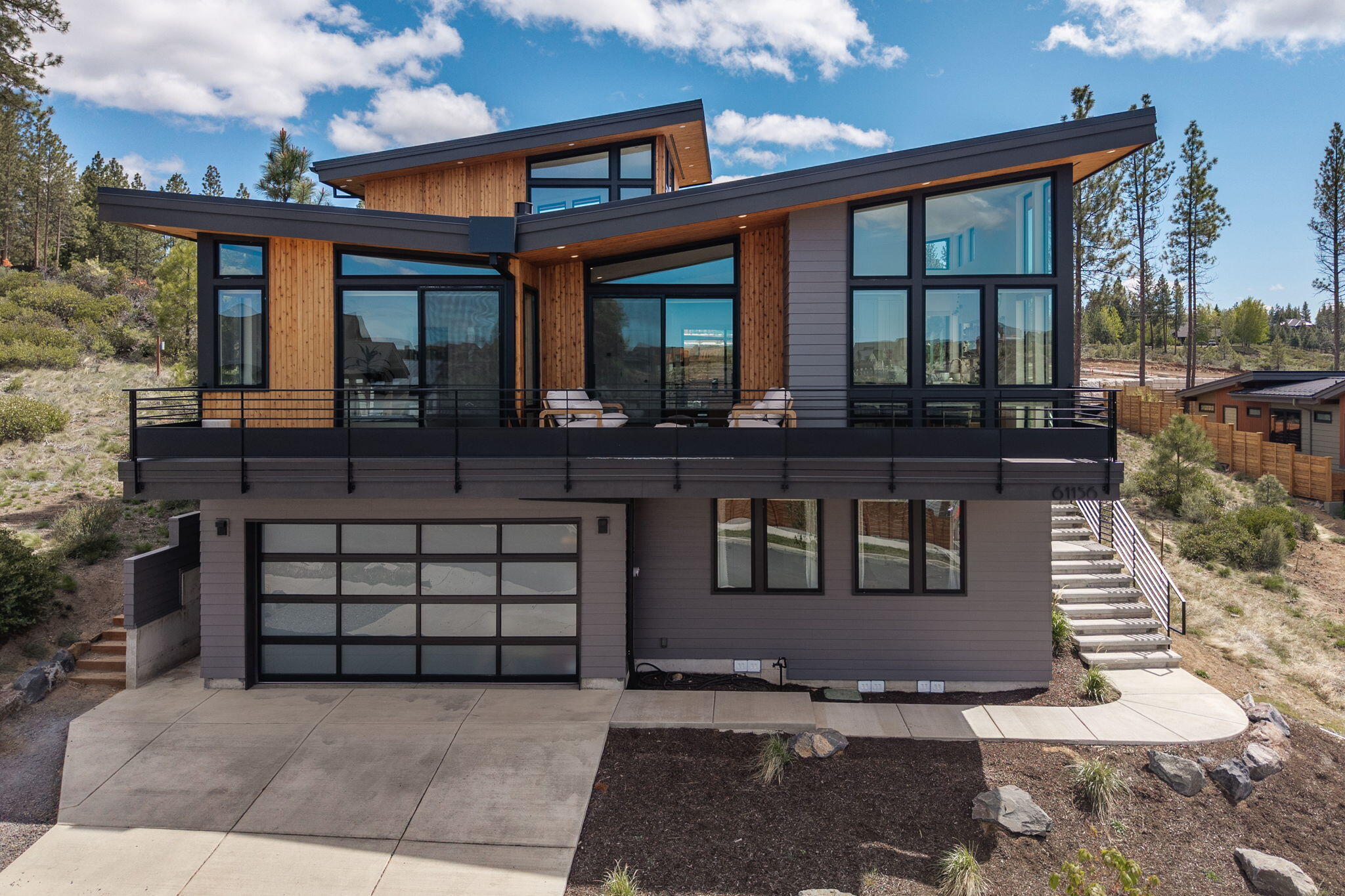Experience luxury in this custom built 3 bed, 2.5 bath home with stunning Cascade Mountain views. French White Oak floors run throughout, complemented by dual zoned central air, and custom blinds. The great room offers a gas fireplace, while the kitchen features Quartz countertops and Stainless Steel appliances. The spa like primary bath includes heated floors, a soaking tub, and an app-controlled Swedish sauna. Custom shelving in bedroom closets and laundry, blackout shades, and stairway footlights add comfort and style. A versatile loft offers space for an office or play area. Additionally, this home includes a large laundry room and a dog bath. 

The extra deep heated garage includes a workbench, workout room with a TV, and a 1100CFM variable exhaust fan. Corian backsplash for the sink in the garage offers stain resistant convenience.
 
Enjoy the fenced and landscaped backyard with stylish sun sails, or the front patio with full mountain views, perfect for entertaining.