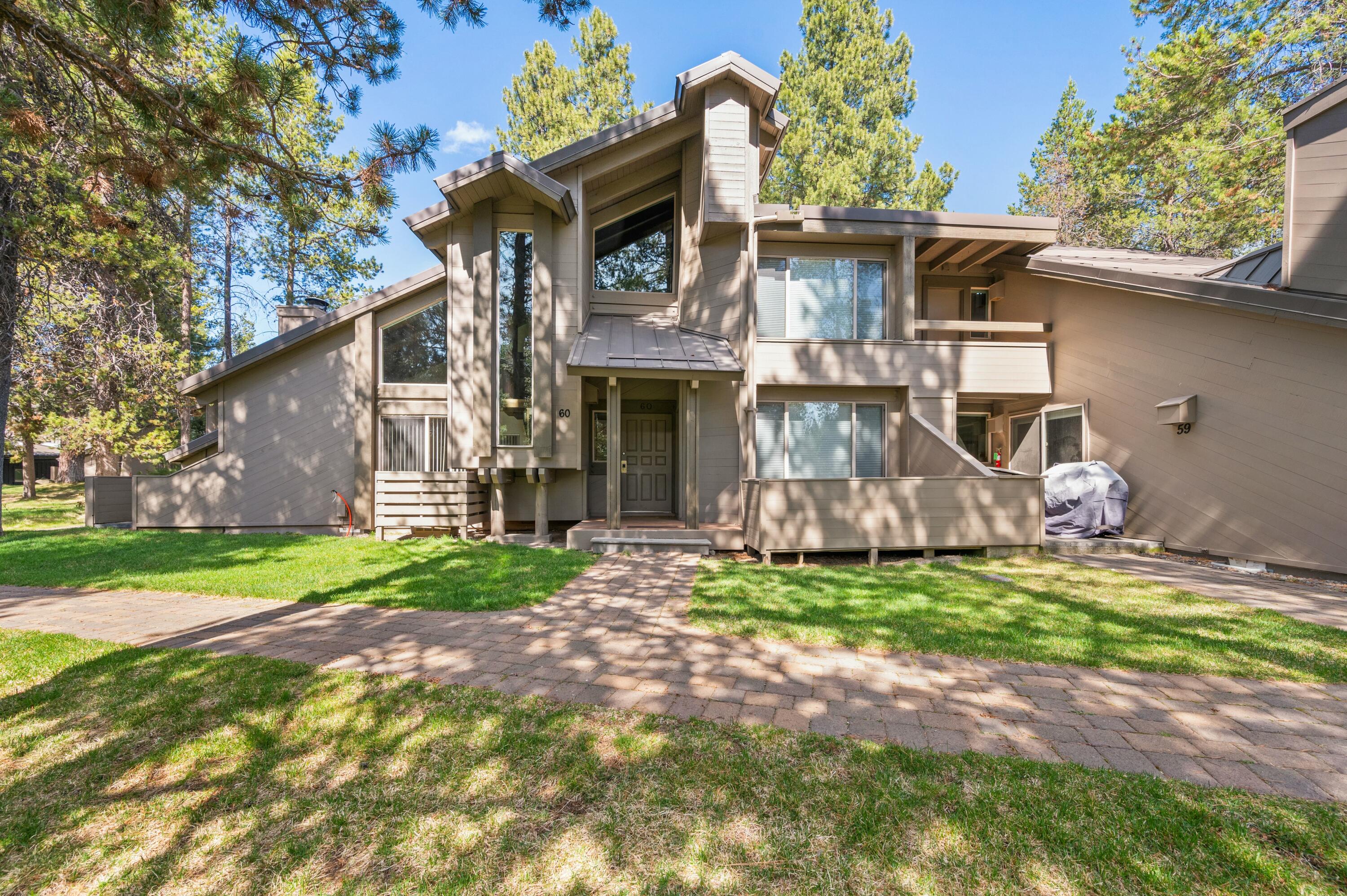 Perfectly positioned for lifestyle and investment, Tennis Village #60 offers prime proximity to Sunriver Lodge with its abundant amenities, including dining, entertainment, golf, aquatics, pickleball, fitness, and wellness, plus the charming Village at Sunriver. This air-conditioned, furnished condo boasts a modern kitchen and bathrooms enhanced with granite countertops and soft-close cabinets. Features include two primary suites, a loft, three patios with a BBQ, and an elegantly tiled wood-burning fireplace. Actively managed by Sunriver Property Management, rental history and bookings for 2025 are available for review.
