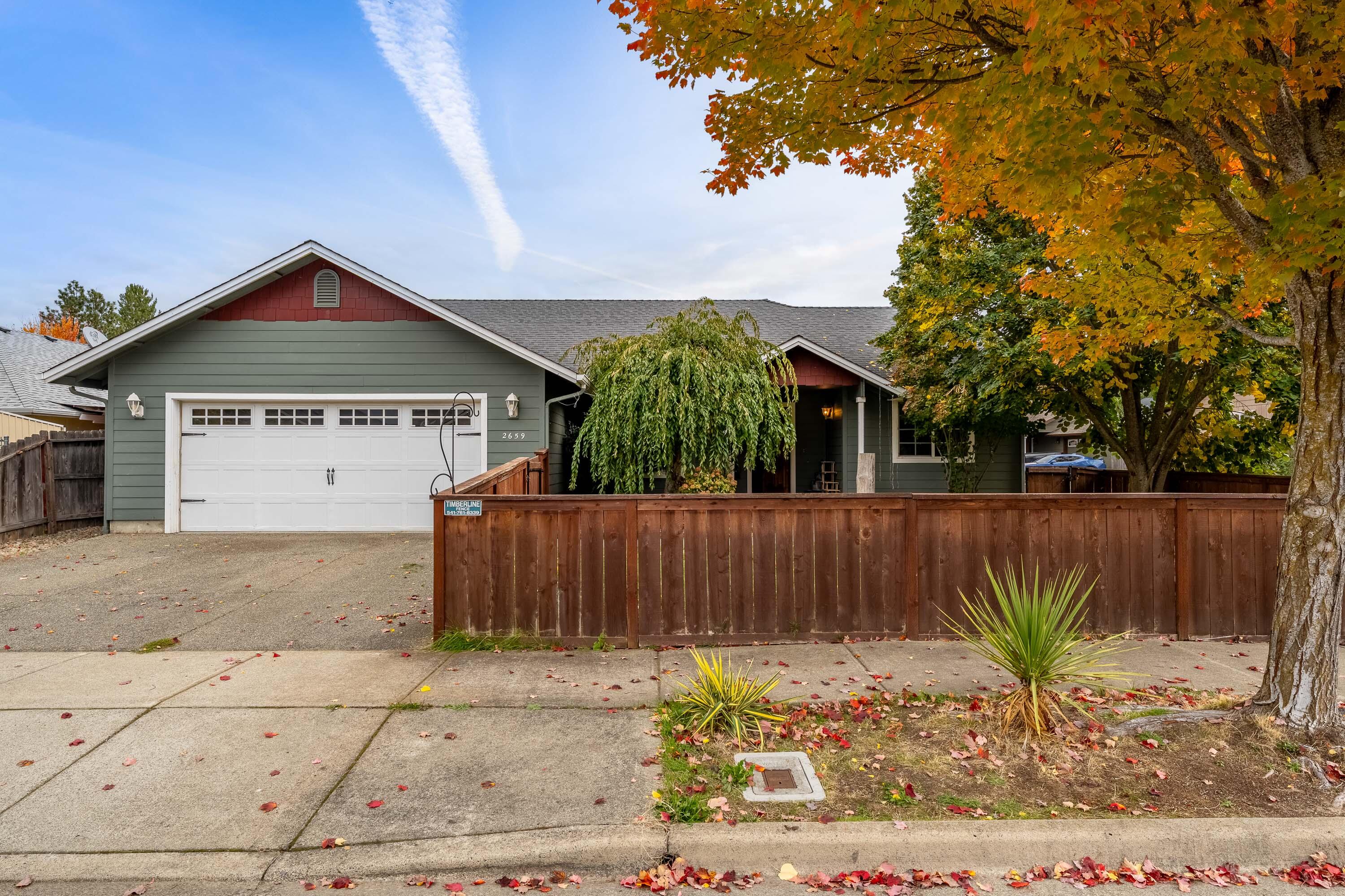 This lovely 3-bedroom, 2-bath home sits in a desirable subdivision in the redwood area and has so much to offer! You'll love the open, inviting layout with a dedicated dining space—perfect for hosting friends and family. The primary suite is separate from the additional bedrooms, offering a peaceful retreat. With a fenced front and back yard, there's plenty of room to relax or play outdoors. Complete with an attached 2-car garage, this home checks all the boxes for comfort and convenience.