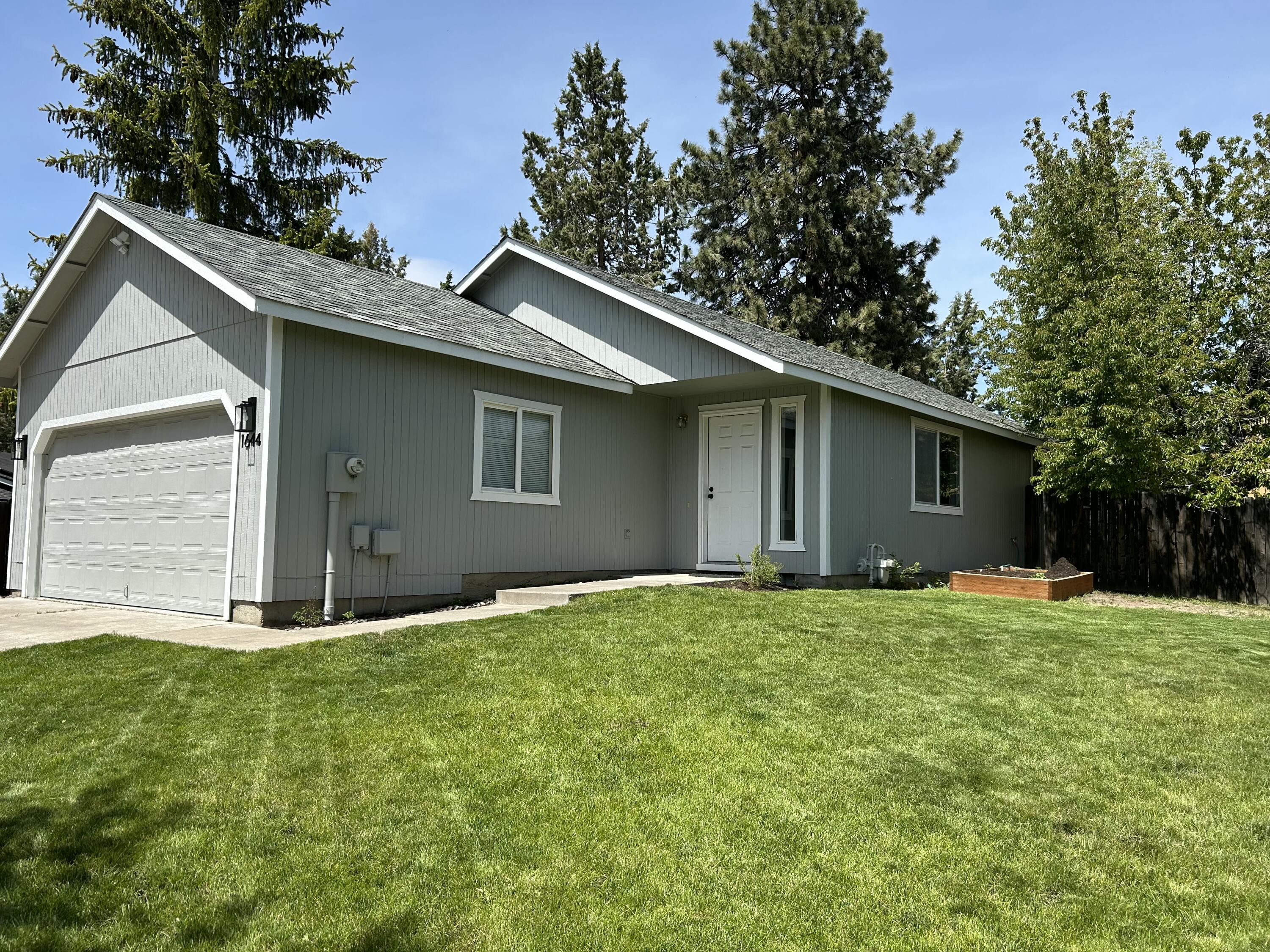 Charming Single-Level Gem in Prime Location! This well-maintained home is move-in ready with fresh interior & exterior paint and new flooring throughout. Experience comfortable living with large bedrooms and the ease of a well-designed single-level floor plan. The home features an open kitchen, dining area, pantry, laundry, forced air heating and A/C for year-round comfort, and an attached 2-car garage. The front & back yards offer space for outdoor enjoyment and privacy. Ideally located near schools, parks, shopping centers, and medical facilities. From first-time buyer to retiree, this property is a perfect blend of turn-key comfort and convenience—don't miss this one!