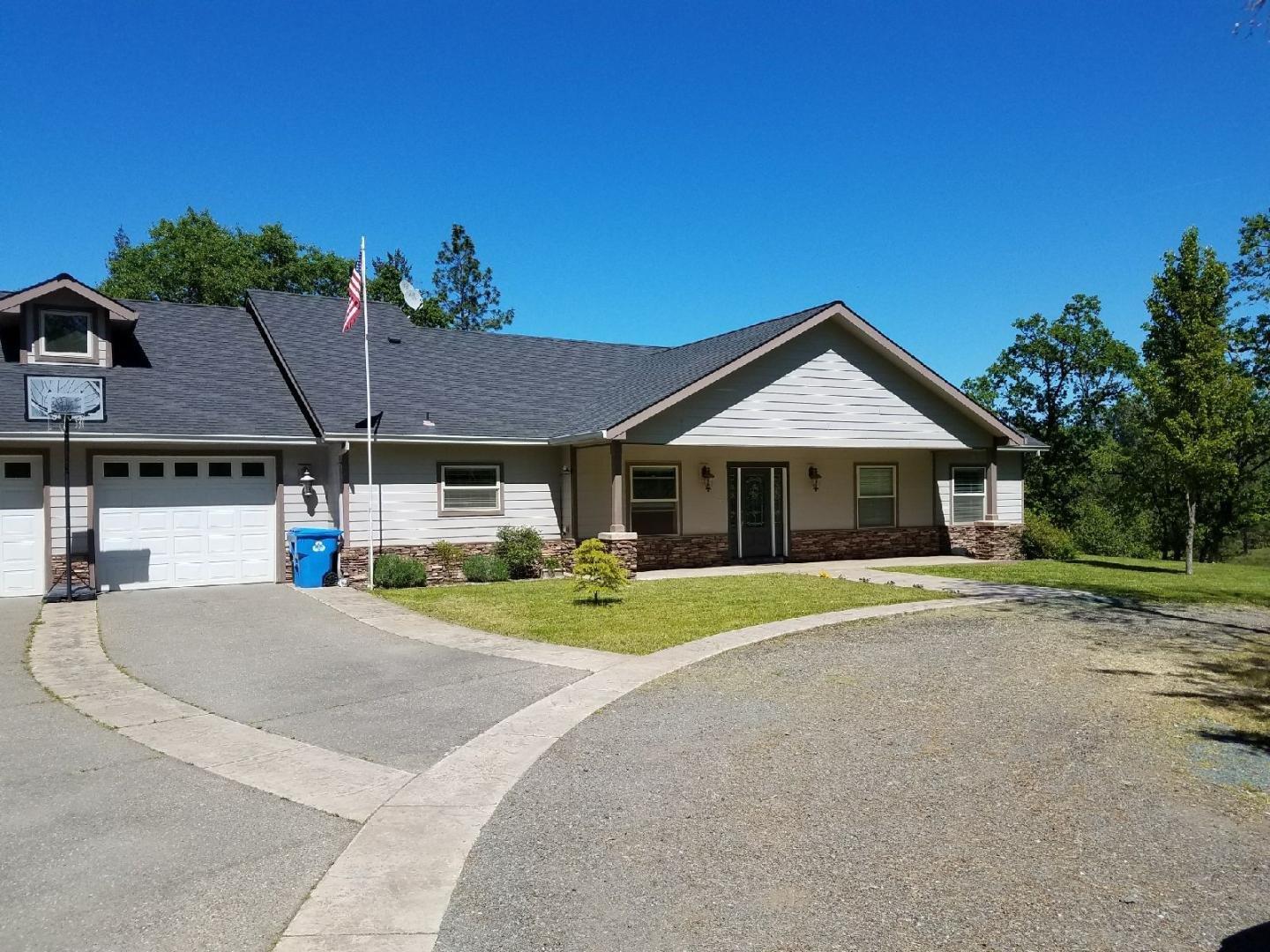 This 4 bedroom 4 bath home will not disappoint and has much to offer; from the large open kitchen with stainless steel appliances, large granite island with sitting bar, high vaulted ceilings in the living room, roomy master bedroom, with a fantastic master bathroom, jetted tub, full walk-in shower, master closet with lots of room, double French doors to the concrete patio and abundant storage space everywhere. The house features beautiful cut-stained & polished concrete floors and a huge pantry. With a trip up the stairs you will find an approx. 1000 sq/ft bonus area, that has many potential uses; game room, gym, or perhaps a 5th bedroom. Out side there is a nice covered patio, and with over 5 fully fenced acres the room to do many things; horses, a few cows and with the irrigation from the bordering canal you could have your very own mini farm or garden. Full RV hook ups to boot. Come take a tour of this custom built home today.