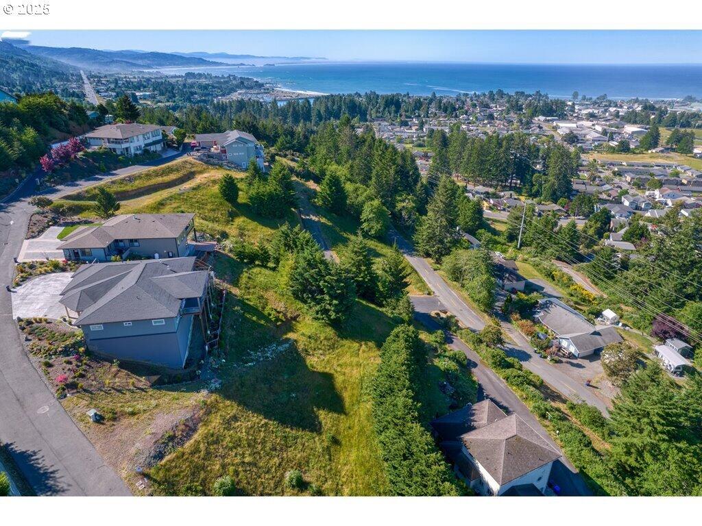 Create your custom dream home in an exclusive gated community where privacy, beauty, and convenience come together. This pristine homesite offers breathtaking panoramic views of the ocean, city skyline, and surrounding mountains—an ever-changing backdrop from sunrise to sunset. Enjoy stunning ocean sunsets and twinkling city lights in the evening, all from the comfort of your future home. Ideally located just minutes from downtown, local schools, and the scenic trails and open spaces of Azalea Park, this lot combines peaceful seclusion with easy access to everyday amenities. CC&Rs require a minimum home size of 2,000 square feet, allowing for a thoughtfully designed residence that truly complements this exceptional setting.