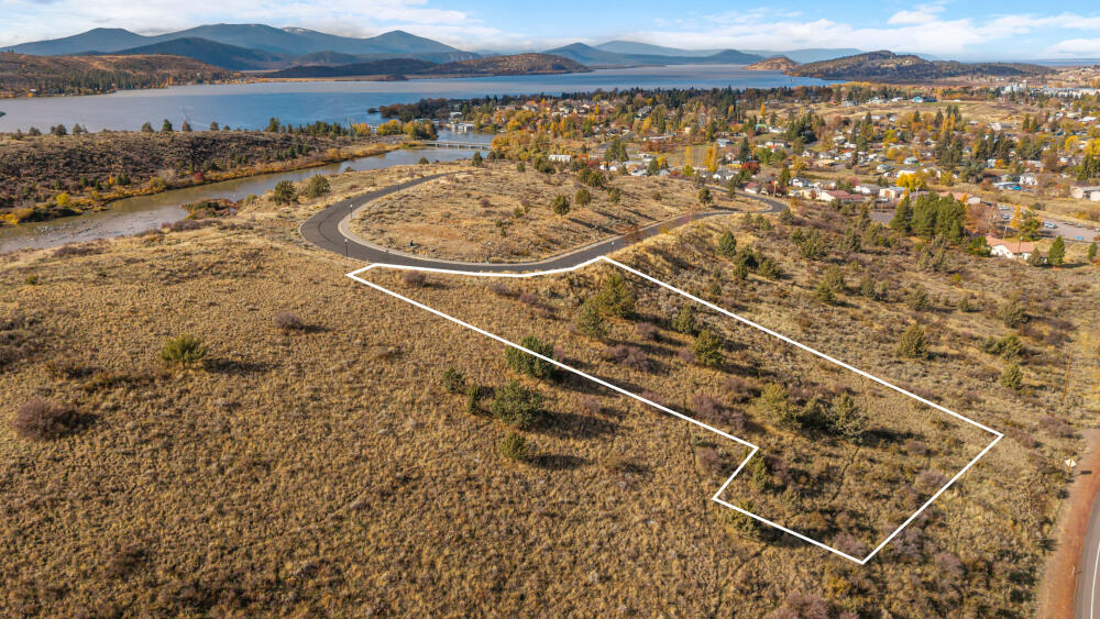 Take in sweeping views toward Downtown Klamath Falls from this sloped lot, offering a beautiful setting for your custom home. Located on a quiet paved loop road in an undeveloped subdivision, this property provides a unique opportunity to build in a peaceful yet convenient location. City water, sewer, and power are all available at the street. Enjoy close proximity to Moore Park's trails, nearby boat launches, Sky Lakes Medical Center, and OIT—everything you need just minutes away!