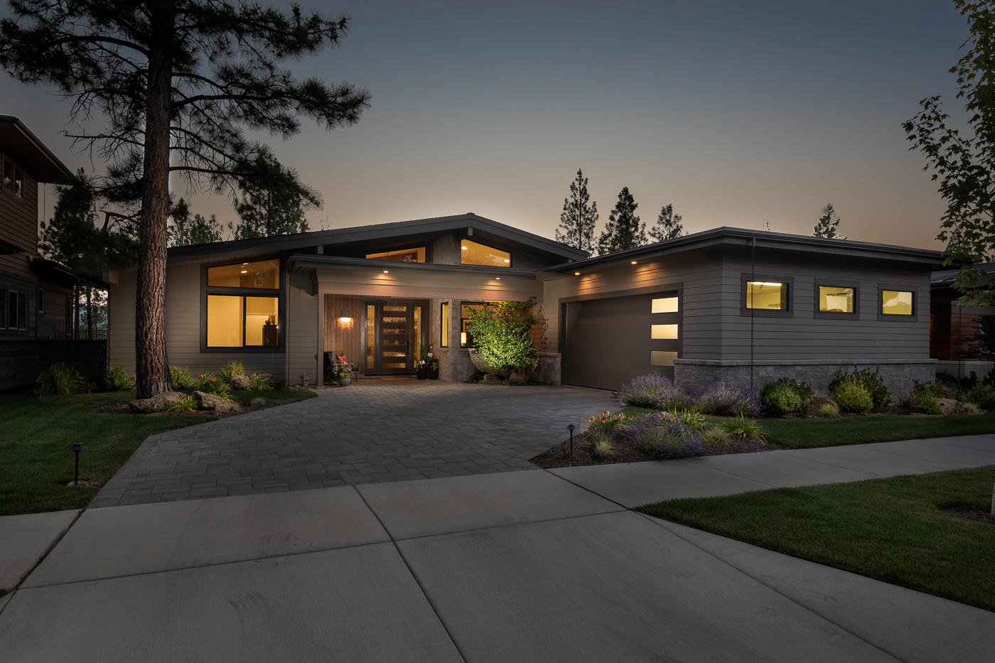 Striking custom built home located in NW Bend! Spacious single level home boasts quality upgrades throughout. Great room with beamed vaulted ceiling, fireplace plus a wall of windows leading out to paver patio with gas fire pit and TV. Kitchen is fully equipped with Thermador appliances, custom cabinets, large island with quartz countertops. Butler pantry complete with dishwasher, refrigerator and prep space to make entertaining a dream. Master suite has beamed vaulted ceiling, fireplace and separation from the rest of the home. Master bath has a soaking tub, curbless walk-in shower, skylights and large closet with built-ins. Guest suite features full bath, curbless shower, walk-in closet with built-ins. Third bedroom has a vaulted ceiling, attached bath with tub/shower combo with tile surround. Large office with vaulted ceiling, spacious mudroom and dedicated laundry room to round out this well appointed home. Close to Shevlin Park trails, restaurants, shops and downtown. A Must See!