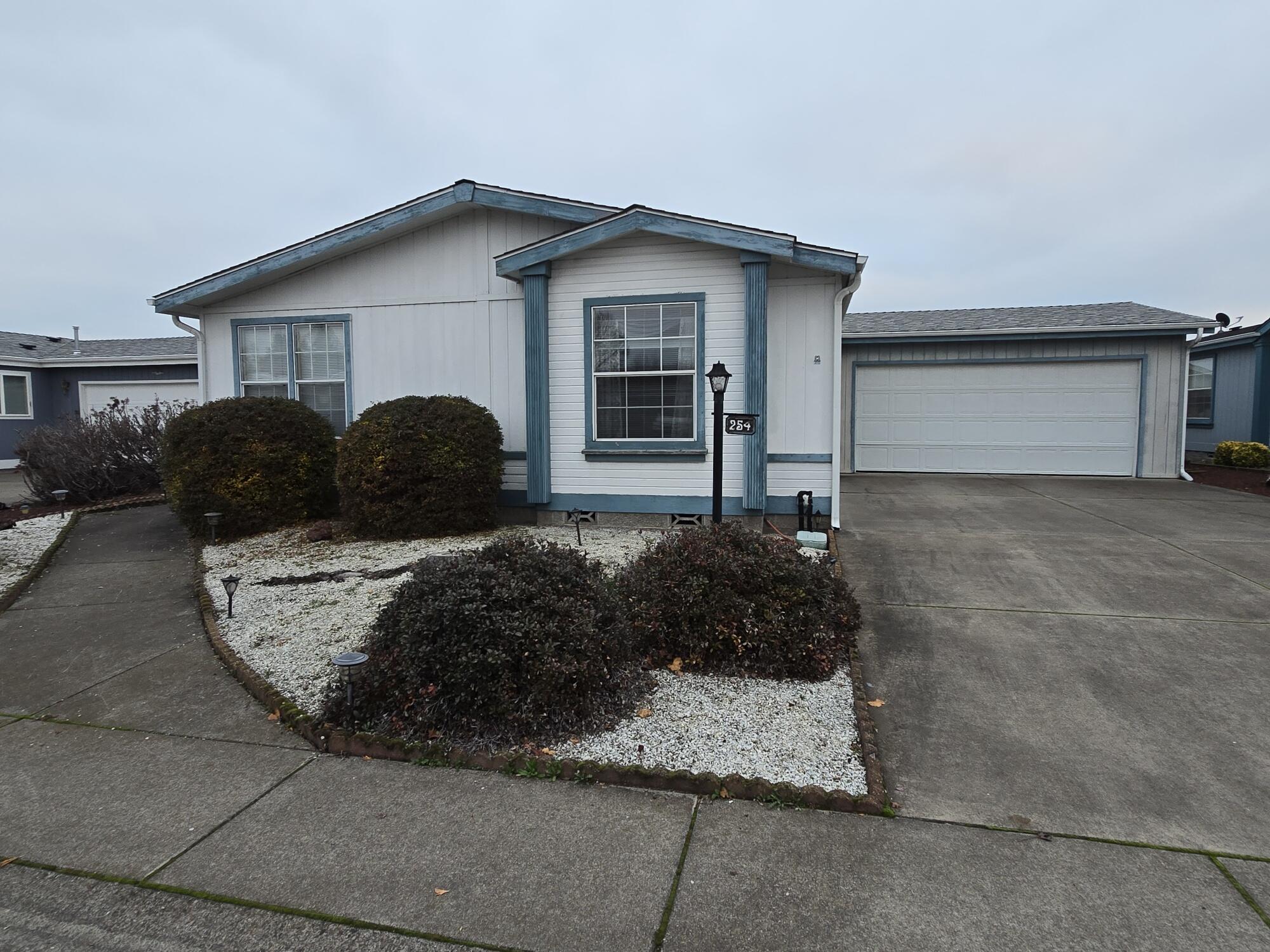 WELCOME TO THE MEADOWS.  Own your own lot with this spacious 2 Bedroom, 2 Bath home located in a very popular Senior Community. Large easy accessible kitchen with an abundance of cupboard space. Over sized garage leading to fenced back yard with storage shed. Plush carpet throughout and 2 dining areas. Association fees include: access to community center, pool, spa, sauna, exercise room,library,. RV storage with small fee. A great opportunity to be a member of this beautiful community and meet new friends at monthly activities.