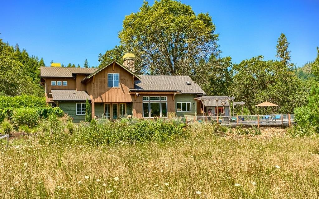Rogue river frontage custom architect designed home on 73 acres. This property has almost an 1/4 mile of Rogue river frontage, Pasture, custom barn, Coop, and Garage. The home provides a master bath in the owners suite with soak tub, Family room and two Fireplaces, Pool, Garden, outdoor Sauna, with outside Bar B Que under covered deck, along with pool house changing room and bath. There is 34 acres of pasture with 34 acres of irrigation rights. Custom barn for livestock, Excellent Salmon fishing from your bank or enjoy the deer, turkey and elk that share the property with the owners. The property backs to several thousand acres of public land for your recreational enjoyment. The ranch is located just north of Medford Oregon and within minutes of the Lost Creek lake for trout, boating and recreational use.
