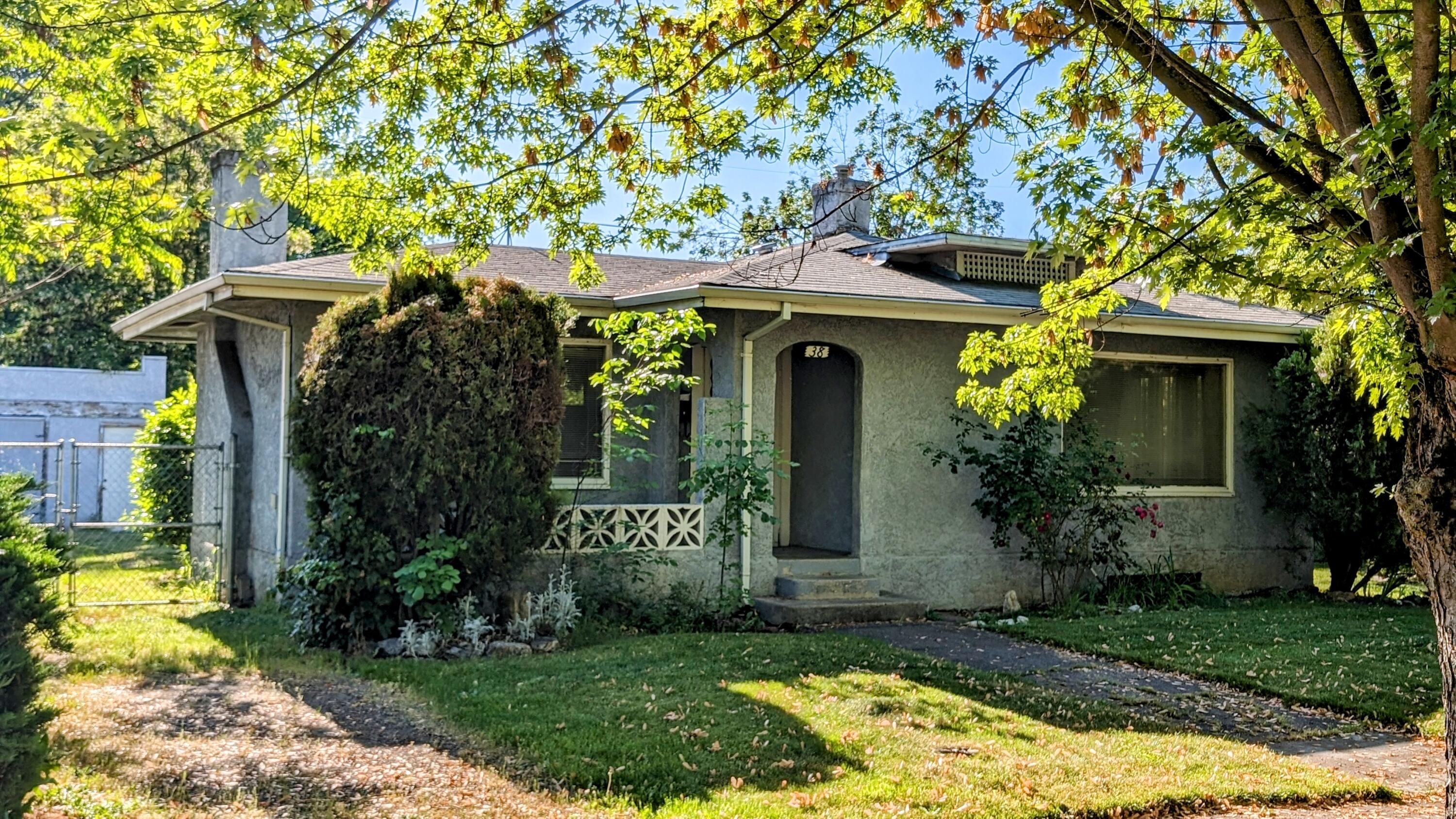 This home features over 1100 sq. ft of living space with two large bedrooms and a full bathroom. Situated on a large lot it boasts RV parking. Inside you will find a large living room with a wood fireplace. There is a dining/eating area as well. The kitchen has plenty of cabinets and counter space. Laundry room is located downstairs in the basement. Outside there is mature landscaping and a shop.