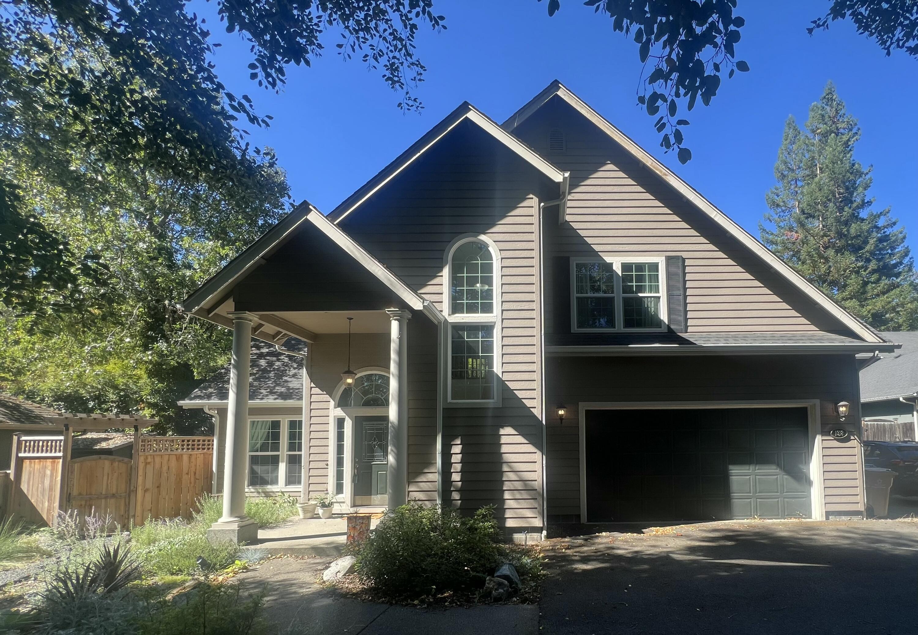 Price reduction, motivated Seller!  Bring an offer!!  Beautifully, well-kept and private home in desirable NW Grants Pass. Off a cul-de-sac, over the creek and down a lane, you will discover this 4 bedroom, 3 full bath home built in 2004. With a creek in the front, private back yard and new drought tolerant landscaping, the outside is as lovely as the contemporary inside. This house includes all the amenities you are looking for in a comfortable home; open concept living area that boasts gorgeous hard wood floors, granite counter tops, even a wine fridge. The second floor holds three large bedrooms, two full baths and the laundry room. The second floor, primary bedroom has a large walk in closet, a sizable tub and stand alone shower. The main level contains another bedroom and full bath. Tranquil, yet minutes from downtown. Come and check it out!! 
Seller is an Oregon licensed Real Estate Broker.