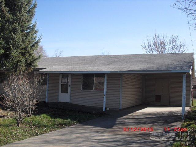 Cute single level home in downtown and close to medical and schools.Has fresh paint inside and all new appliances,vinyl siding and an attached carport plus a two car garage w/a shop area plus alley access in back with RV parking. Yard is landscaped with fruit trees and is fenced. Newer carpet & being sold as is.Extra storage room where furnace is for freezer or pantry. Well for watering yard. See attachment for PAS requirements and WFHM offer submittal information in MLS document section.