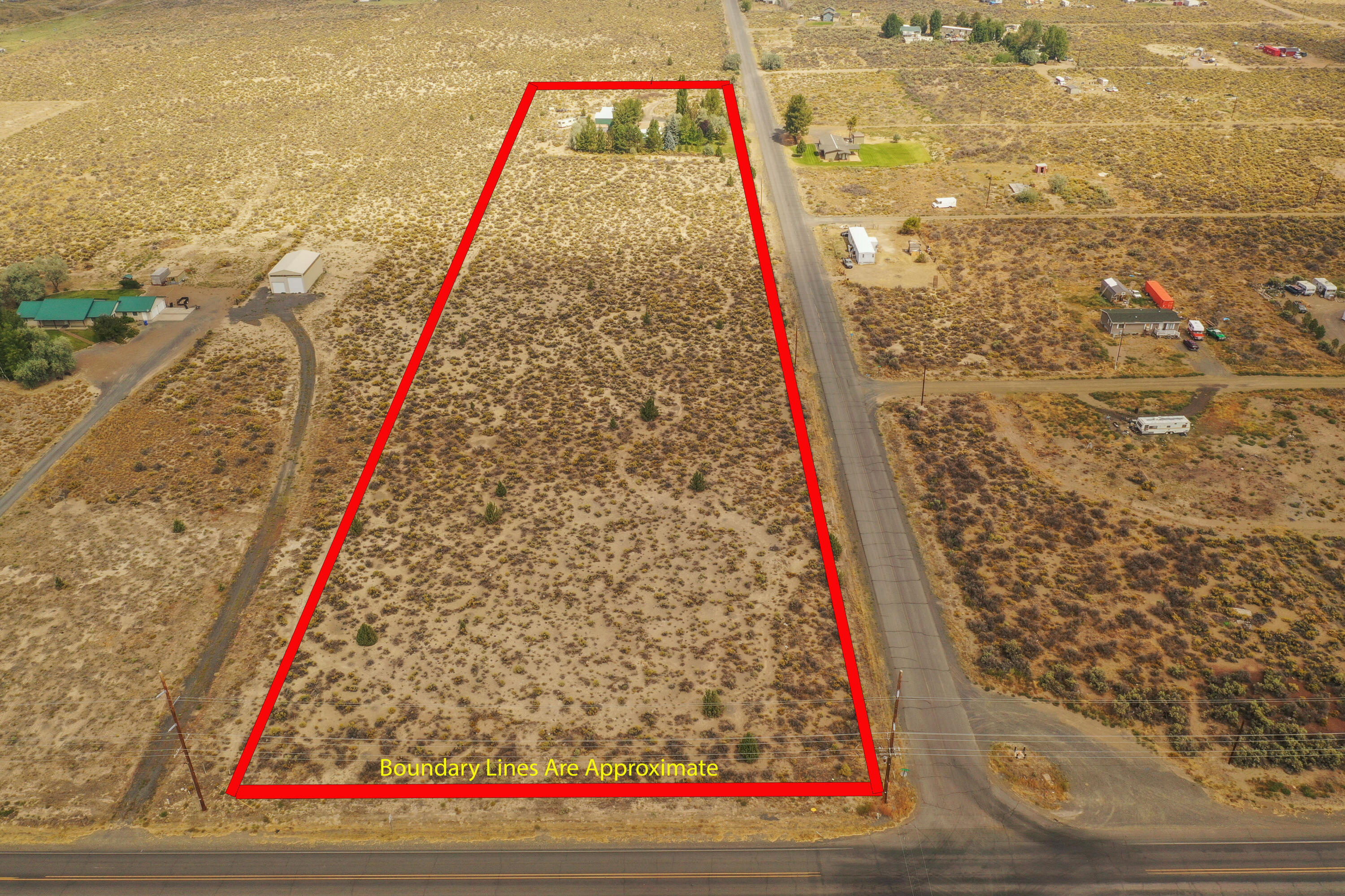 7.81 acres on the Edge of Town close to the downtown park and amenities. Corner of Christmas Valley Hwy and Rainbow Rd, the house and shops are situated toward the back of the property away from the Hwy and there's lots of trees for privacy. Plenty of room for horses, farming, parking or more shops. A nice little portion of the home upfront has been utilized for a small business with a separate entrance or could be used as the 2nd bedroom/mother-in-law. Fantastic shop with loft area and additional large covered parking structure. 16x16 Covered Porch off the Primary bedroom with a nice hot tub that may be included in the sale. Motivated Seller is currently removing many personal items so the property will be changing weekly.