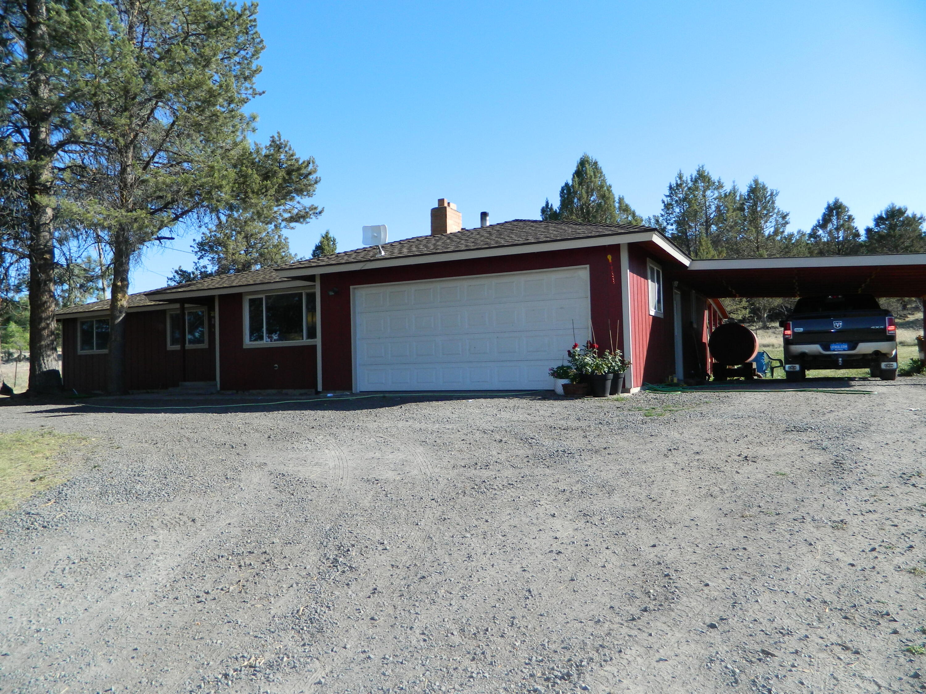 Hard to find home on acreage. This 3 bed 2 bath home is on 6.23 acres just outside of Dairy. It has a view that overlooks the farm grounds below. There is a living and family room, 2 car attached garage and carport