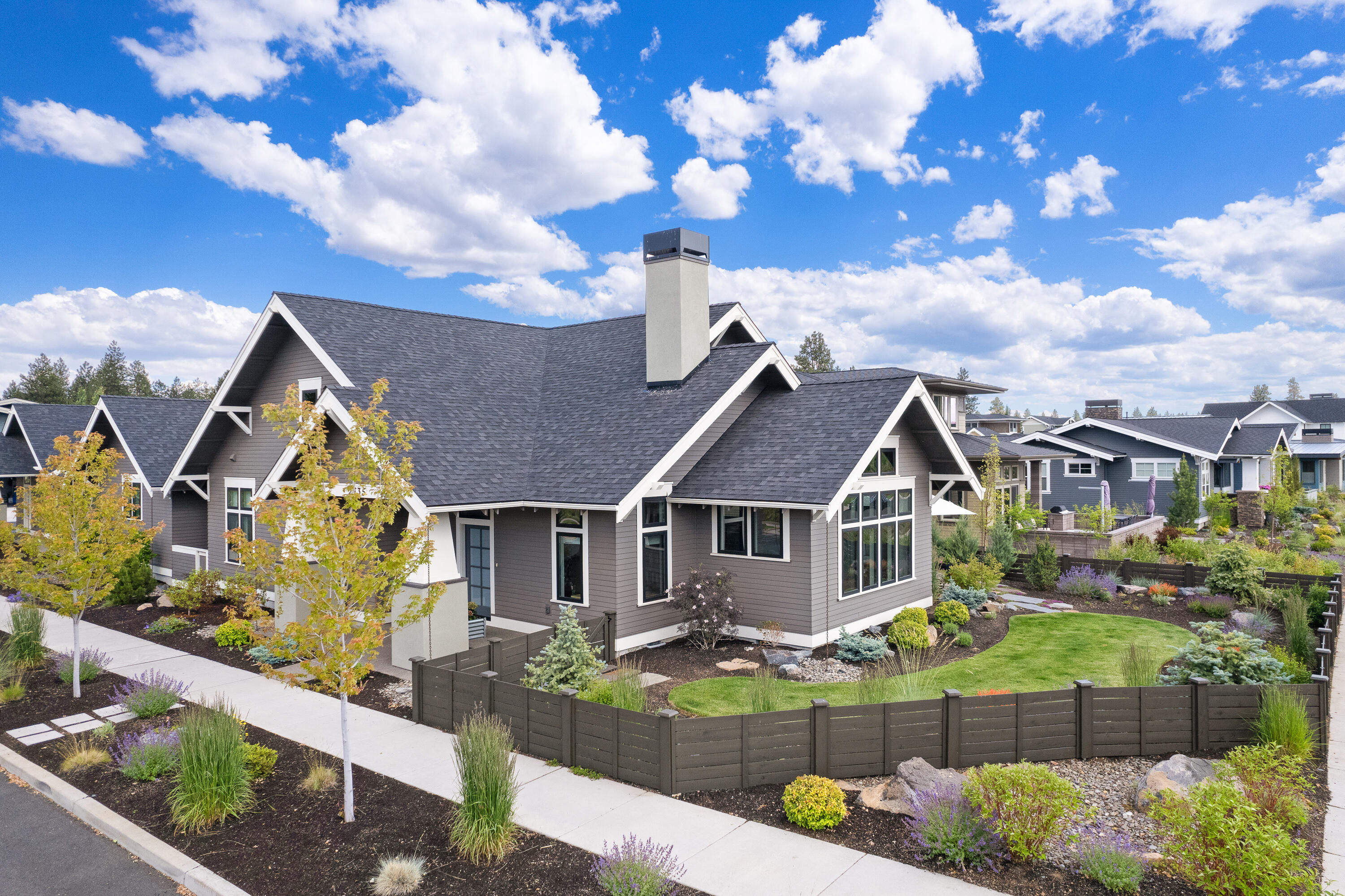 This beautiful and sophisticated home effortlessly blends timeless style and reclaimed wood to provide a contemporary, clean feel on a corner lot in one of the most desirable neighborhoods on Bend's Westside. The soaring vaults in the main room provide a wall of windows that look out on Discovery Park and the pond while letting the natural light in. Stunning kitchen with JennAir appliances and large island with slab quartz all around, perfect for gathering and entertaining. The patio off the dining room is a beautiful extension of living space and offers more gorgeous views. The designated office with built-ins provides a perfect work from home space. The 576 sf casita (ADU) is a one bedroom, one full bath, with full kitchen perfectly set up for a guest suite, multi-generational space or an income producing rental. Other features of this incredible home include a 3-car garage (one separate garage space for ADU) & a large laundry and mudroom.