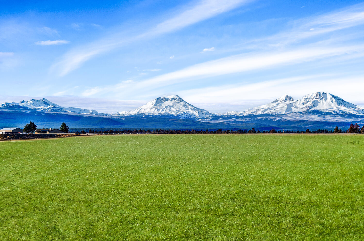 Picturesque setting on 126 acres of serene farmland with pressurized water delivery irrigation in the vibrant community of Sisters. Positioned with outrageous views of the towering Cascades, Tumalo Farms is perfect for one seeking a private getaway enveloped in 360 degrees of majestic landscape. This property is comprised of 1 tax lot with a manufactured home to live on while you build your dream home farther back on the most beautiful part of the property. Grow your own crop or lease to a custom farmer. This parcel, once part of the equestrian training grounds of Tumalo Farms, is rich in history and has a unique story to share. Whether you are looking for a unique horse farm with income to escape the crowds or are searching for the ideal spot to build your dream home, Tumalo Farms won't disapoint.