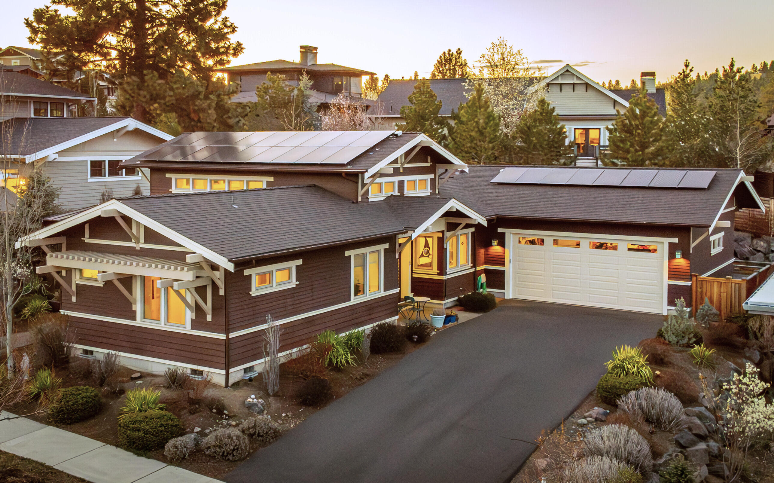 Single-level living. Elevated design. Light in every direction—with soaring ceilings to match. Located in NWX, this Earth Advantage Platinum and Net-Zero certified home by Greg Welch blends intentional design with energy-efficient features throughout. Just 0.2 miles to Compass Park, 0.3 miles to The Grove, and a block from Bend Park's trail system.

Clerestory windows, skylights, and solar tubes fill the open floor plan with natural light. The kitchen, dining, and living areas live as one bright, open space with views out to the private patio and premium Jetsetter® spa featuring silent circulation.

The spa-style primary suite includes a walk-in closet, heated tile floors, and a full tile shower. Outside, enjoy a covered front porch, side yard, raised garden bed, and shed. A long, level driveway leads to an oversized garage with built-in storage, a workbench, and a Level 2 EV charger.

Plus a 26 panel owned solar setup & net metering w/ power company. 10/10 Home Energy Score.