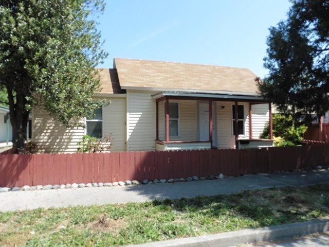 Cute cottage style home with a front porch, fenced front yard and fully fenced large back yard with alley access. Home has had some updating including kitchen cabinets offering decorator space on top. Nice size living room. Located in desirable District 7 schools and convenient to downtown.