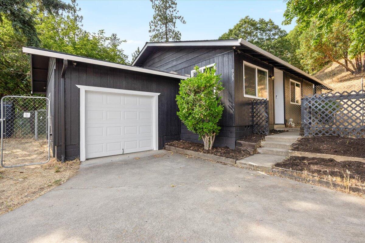 925 6th Ave is an adorable 3 bed, 1.5 bath 1,102 sq ft home on a generous 0.26-acre lot with mountain views. Amenities include HVAC system with advanced filtration, brand new roof, attached 1-car garage, two versatile spacious outbuildings for storage, fully fenced yard, & spacious dog run perfect for pets, and all on city services. Gold Hill's charm extends beyond your doorstep - within minutes to the community's river beach access as well as a river park featuring boat dock access to the scenic Rogue River, skate park for adventure seekers, baseball field, & dedicated dog park. Gold Hill blends outdoor recreation with small-town tranquility. Enjoy peaceful neighborhood living with hiking, fishing, & river activities at your fingertips, yet just 20 minutes from Medford's shopping, dining, and urban conveniences. This property delivers comfort, recreation, & endless possibilities in one of Oregon's most charming communities.