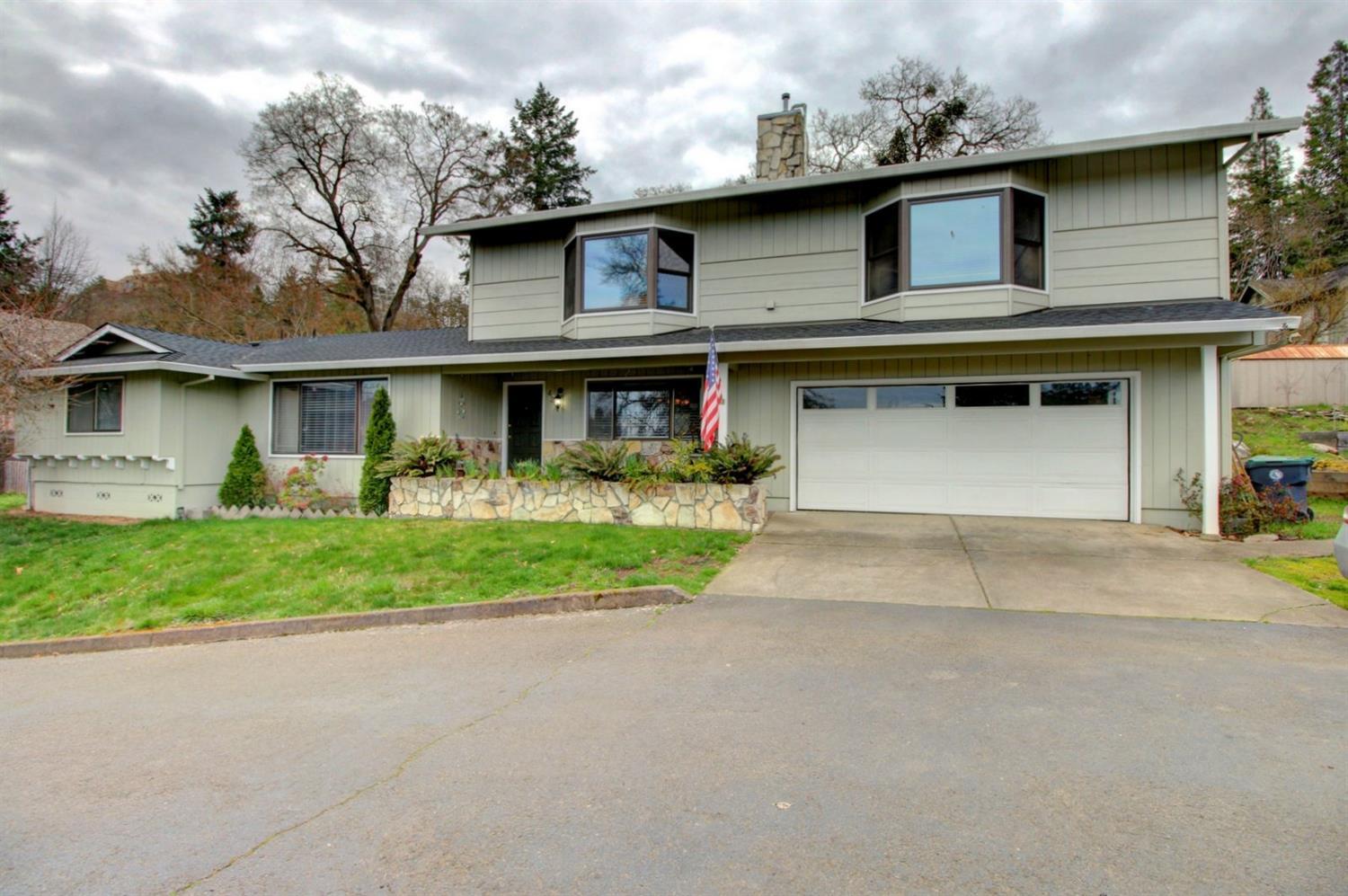 Incredible View Home w/Tons of Upgrades & Extras Throughout Located In a Quiet, Desirable Old East Medford Cul-de-sac Location. 4 True Bedrooms + Could be Perfect 2-Family Set Up. (Beautiful extra master suite upstairs as well as 1 on main level). Huge .34-acre lot, 2677 sq. ft. home complete with 30x66 sport court, raised garden beds, paved patio overlooking mature landscaped yards & attached 2-car garage. Large updated kitchen w/concrete countertops, gas 5-burner stove & double oven, tile floor, custom cabinets & 2 pantry areas. 3 of the bedrooms are on the main floor, including one of the 2 master suites. A 2nd, huge master is on the second level w/sitting area, big walk-in closet & a spa-like remodeled master bath that will truly WOW you; double-sided gas fireplace backs the family room. Newer roof w/a 50-year transferable warranty per seller + room for a small RV or boat.