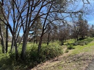 Check out this beautiful Running Y lot in the Lakeside neighborhood. Running Y Homeowners enjoy not only the natural beauty of the Running Y Ranch Resort, but also HOA amenities that include the Sports and Fitness Center with pool, hot tub, sauna, weight room, pickle ball and tennis court, playground and more. You can also enjoy the miles of paved walking trails, the Arnold Palmer golf course, and beautiful spa.