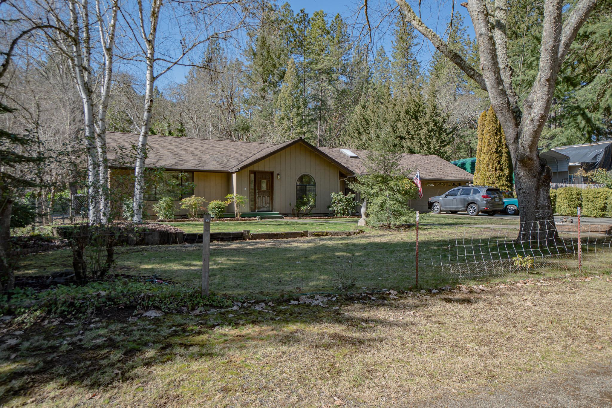 This is a Must see! Charming one story ranch style home with a flat usable 1.49 Acres! The Kitchen has been recently remodeled with new high end appliances, Granite countertop and huge Island. Primary bathroom has been remodeled and beautifully done. New flooring throughout and vaulted ceilings highlight this beautifully done home. Park-like setting backyard with a small barn, green house and storage shed with power and plumbing. Has a HUGE 30X40 Fully permitted and finished shop with Concrete epoxy coated flooring and 110/220 Power and 50 amp RV Hookup, a must have! Tons of parking and privacy as this home is tucked away off of W Evans Creek with a private driveway! Don't miss out and call for your tour today!