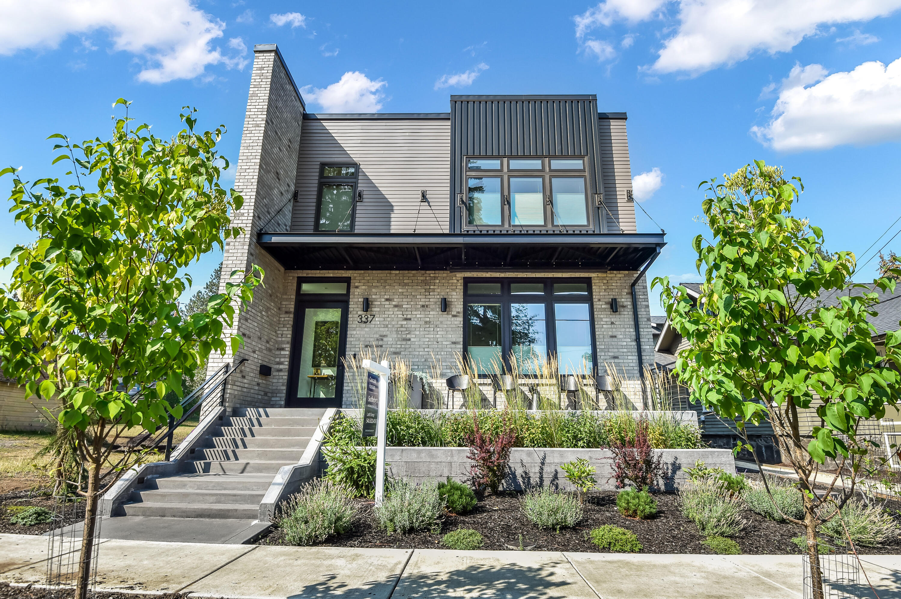 Set on the vibrant westside humming to life, this residence is a rare expression of luxury, rooted in timeless craftsmanship. Thoughtfully designed with fire-resistant exterior materials, expansive Marvin windows, and a custom pivot front door, every detail reflects quality and intent. Inside, curated interiors feature 8-foot doors, solid bronze hardware, custom cabinetry, specialty lighting, and heated floors throughout all full baths. Additionally, an independent one bedroom and one bath guest residence above the garage offers rare versatility for hosting or additional income. Enjoy a fully irrigated perennial garden, direct gas connections for outdoor living, and a home that embraces sustainability with an integrated solar energy system. A true blend of inspired design and effortless living in one of Bend's most vibrant settings.