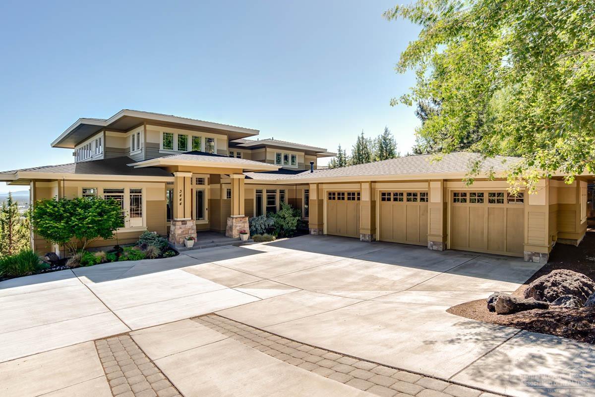 Classic Prairie style w/ panoramic views of the Cascades, Smith Rock & Ochoco Mtns. Open concept w/ high ceilings. Kitchen features 5-burner cooktop, dbl ovens, prep sink & more. Wrap-around, covered deck offers great outdoor living space. All 4 bedrooms have private baths. Master, office and 1 guest suite on main level. Master suite has a fplc, WI shower, heated floors in bath. Big loft w/ 2nd deck. Oversized, 3-car heated garage. Heated driveway, pretty water feature. 1000+ sqft of storage below the home!