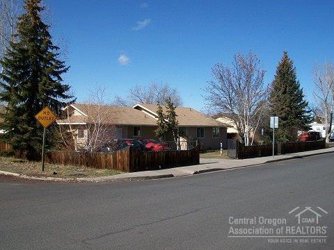 Very light and bright home on almost 1/4 acre, corner lot. New paint inside and out. New floors thru out with laminate wood floors in main living area. 8 foot patio door in Living room. lots of closet space. Fully fenced and gated with RV parking and storage sheds. water feater, fire pit and deck. Wired for hot tub + 220v plug in finished garage. Side street is a cull-de-sac.