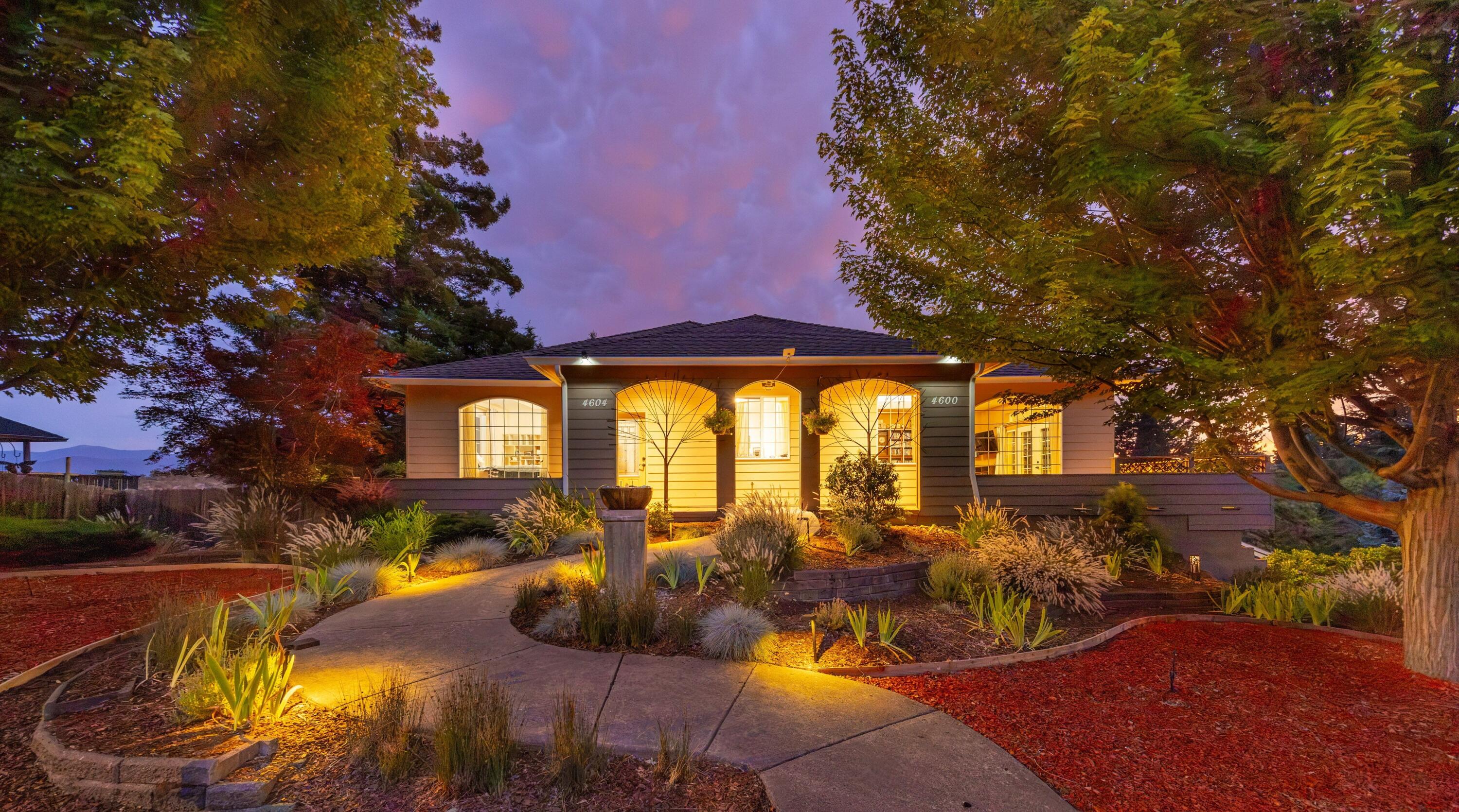 Two homes! Spacious 4,639 sq ft total, 3-stories, 4 car garage - all custom-built in 2004 w luxury & practicality in mind on a 0.22 acre lot. 

Main home features 3 bedrooms, 2.5 baths, living room (w pull down 10 ft movie screen projector), office, kitchen w granite countertops, 14 ft island that seats 10 chairs comfortably, formal dining w 9 ft ceilings, & ADA friendly hallways & bathrooms.  

The attached second home at 4604 has a separate entrance w main level living & potential for rental income. Includes 1 full bedroom, full kitchen, living room, bathroom, & laundry w deadbolt doors for add'l privacy from the main home. 

Huge 1100 sq ft basement plumbed for a future bathroom or use for even more storage needs. 

FOUR car finished 1100 sq ft garage + Storage galore in pantry room w ductless HVAC unit. 

Easy to maintain & beautifully landscaped yard, 25 ft rock climbing wall & stunning views of the valley. 

Close to town for amenities, hiking, biking trails & more!