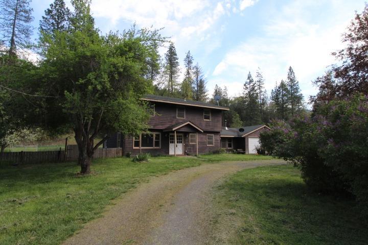 Applegate Mini Farm w/ Great Potential! 1.17 level farm land with a nice size 2132 sq.ft. two story home, ready for your personal updates. New carpeting throughout, new shower in master & new tub enclosure in upstairs bath. 2 car garage, horse barn & other outbuildings. Ideally located in the Applegate Valley, just minutes from the town of Applegate. Good producing well, recent well flow & septic inspection done. . Can be purchased with the 5.16 acre parcel located behind this property