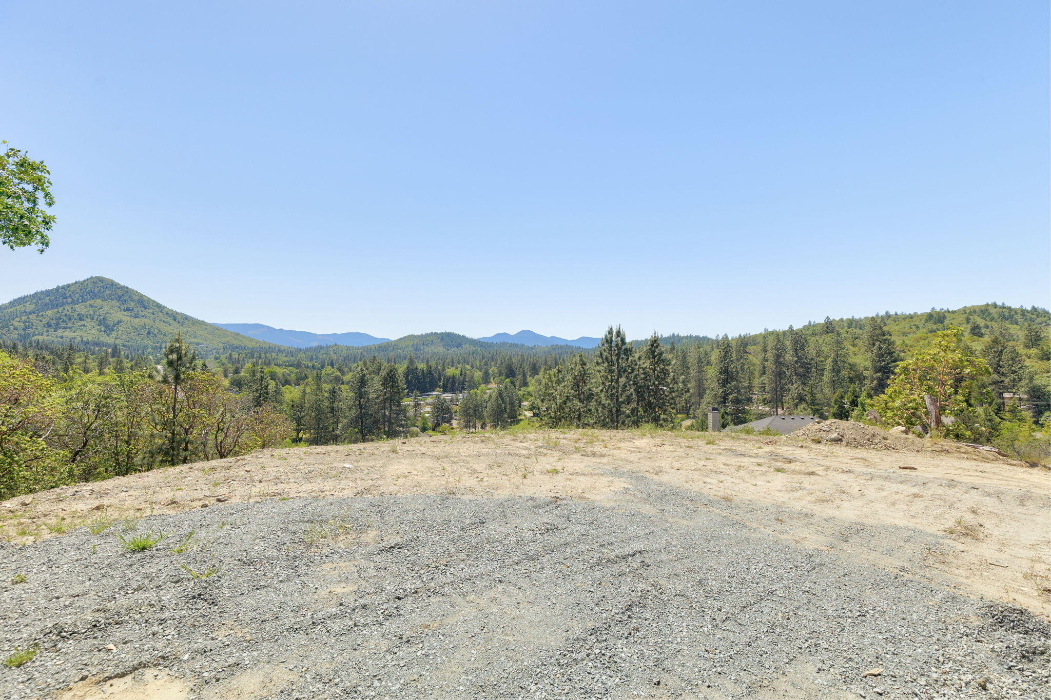 Witness stunning, panoramic vistas from this amazing, suburban lot overlooking babbling Fruitdale Creek and the beautiful Silverbrook Forest Reserve. The pasture on the hill below is reserved forest space. Your privacy is assured and your access to enjoy it is deeded. Just over a mile from an entrance to the amazing Cathedral Hills trail system, and only about 10 minutes from Old Downtown with a myriad of restaurants and minutes from shopping and the Grants Pass Golf Club. The Fruitdale Creek Trail below meanders beside the creek to the majestic Rogue River and the incredible River's Edge Restaurant. Bring your hiking shoes, bikes and maybe some fishing gear to where Chinook Salmon and Steelhead abound. Spectrum High Speed Broadband internet available. We have top quality builders available to make your dream home come true. Or you may certainly bring your own. Country serenity with rural feel, yet city services and just a few minutes to town. CALL TO SEE THIS ONE TODAY!!!