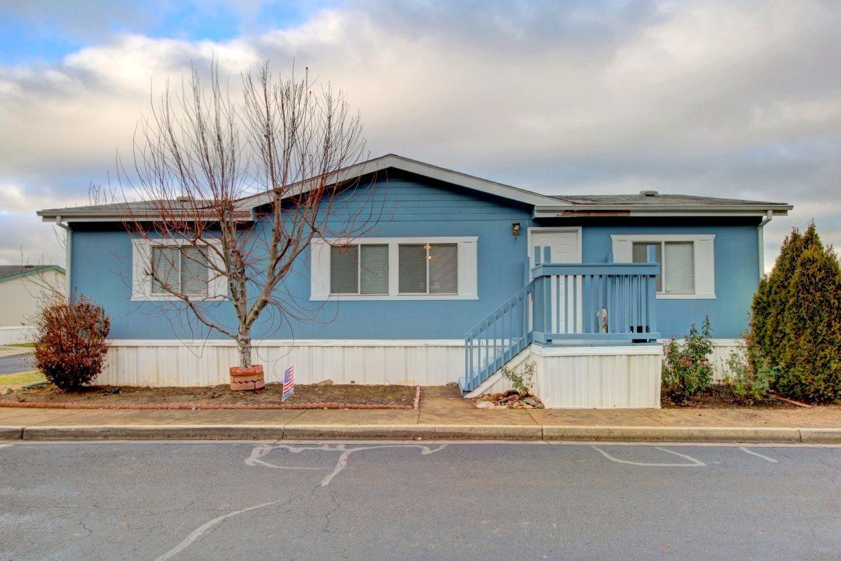 This cozy home greets you with a spacious, open living room with fresh paint and new carpet throughout! A 3 bedroom, 2 full bath, 1,188 square foot manufactured home is perfect for a first time homebuyer, young family, or senior retirees! The home is located on a corner lot in the all-family park, Meadow View Estates. This well cared for doublewide has a split floor plan with deluxe master suite/bath package - vaulted ceilings, big garden tub, separate shower, double sinks and a walk-in closet. The large fenced in back yard is perfect for pets or a playground. This home also features a large deck and a detached storage shed. Don't miss your chance to own this beautiful home! Space rent is $515.00