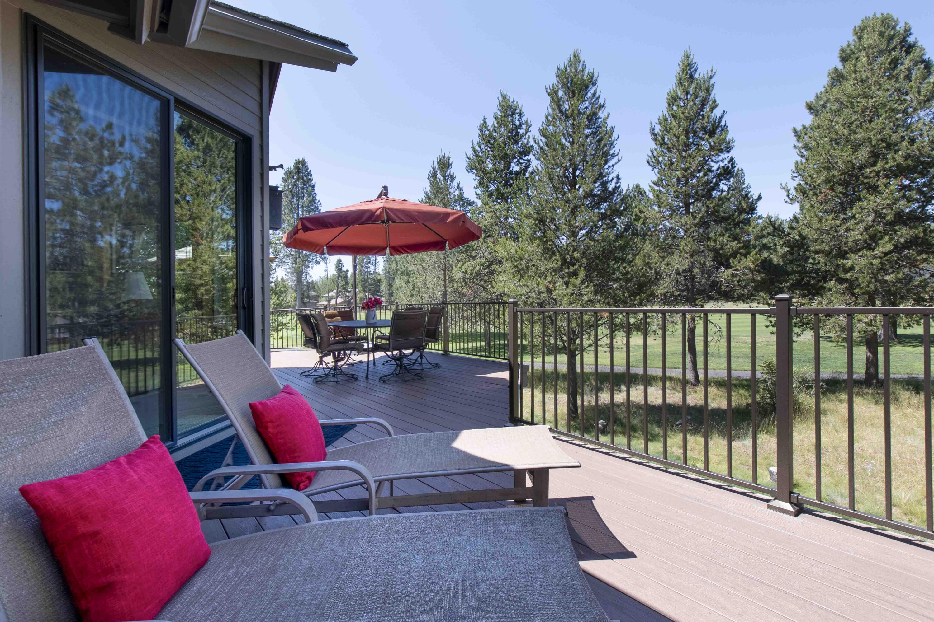 Custom-built Steve Madsen home on Woodlands GC, now available for the first time on the market! This remarkable property offers a reverse living layout that creates a captivating tree house feel, offering glimpses of Mt. Bachelor. Upstairs the vaulted great room is highlighted by a cozy wood-burning fireplace. Cook's dream kitchen features excellent storage, granite countertops, convenient eating bar, and spacious pantry. Access the front deck from the kitchen for outdoor dining and entertaining. Recent upgrades include newer low-e windows throughout, ensuring energy efficiency and a modern aesthetic. Expansive rear Timbertech deck looks out to the GC. Upstairs, ductless cooling provides comfort during the warmest days. The home boasts 3 bedroom suites, providing ultimate comfort and privacy for all. The 2-car garage offers storage space for recreational gear. SHARC Paid. Live your dream in this custom home, where every detail was carefully considered!