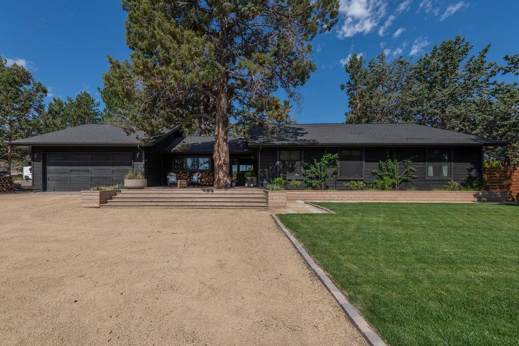 This single level (4 Bedroom 2 Bath) ranch-style home was completely transformed into a timeless retreat, blending warm, organic textures with modern functionality. With an expanded primary suite and an additional guest bedroom, the renovation added 500 square feet. Simple but quality materials include new hardwood floors, stained ceilings, custom white oak cabinetry, natural stone tiles and thoughtful lighting. Inspired by the surroundings of Central Oregon landscape, the interiors feature a layered, earthy palette and collected elements that tell the story of a relaxed and welcoming family home.  Oh and did we mention the amazing views of the cascades, the converted man cave from a Tuff Shed, and the mere 15 minute commute to downtown Bend.