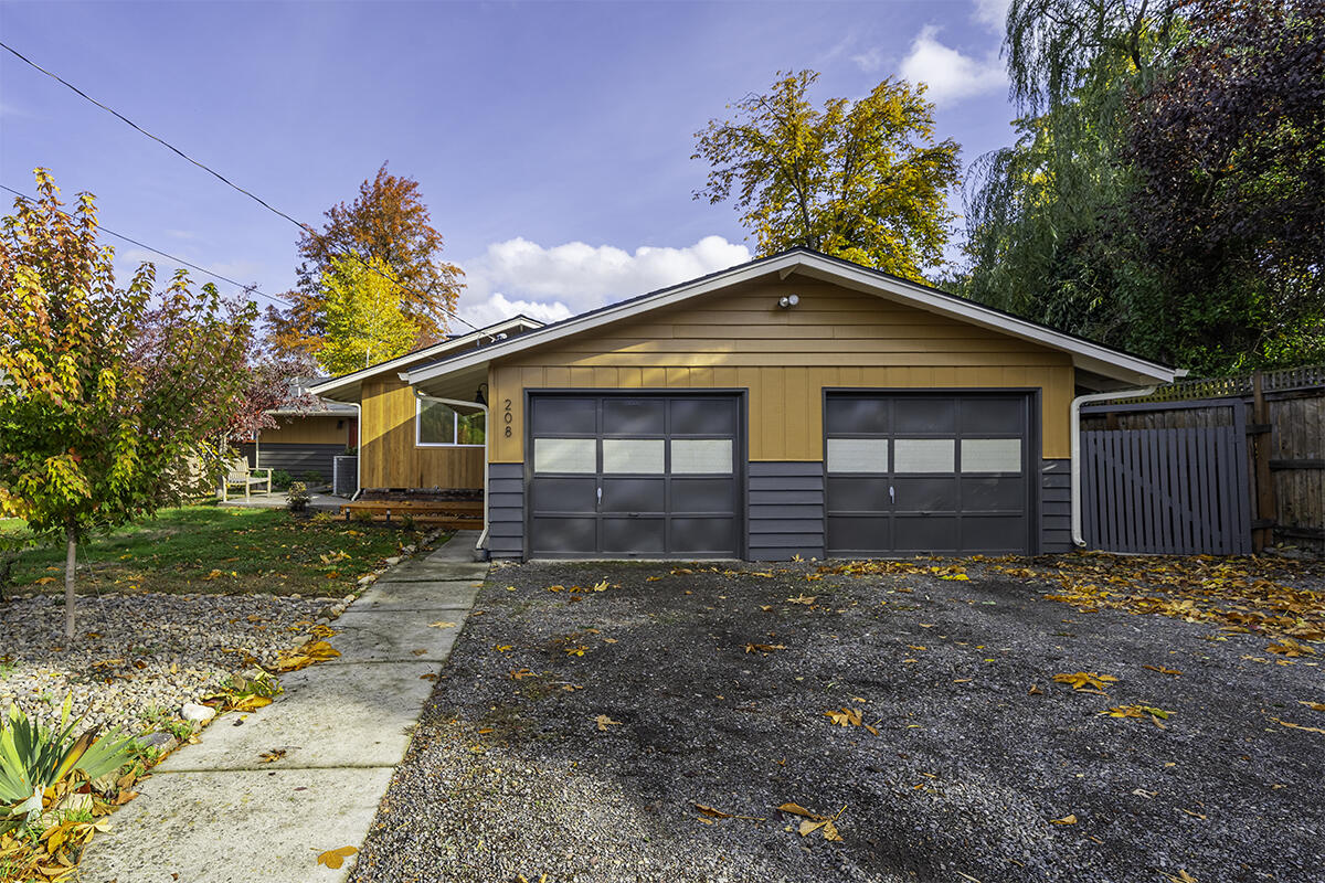Fantastic, East Medford home conveniently located within minutes of schools, shopping, parks, medical & more! This newly renovated 3 bed, 2 bath is full of whimsical updates & one-of-a-kind details including stylish designer lighting, fresh interior & exterior paint, NEW windows & NEW flooring throughout. The light & bright kitchen features beautiful butcher block countertops, breakfast bar & freshly painted cabinetry. It seamlessly connects to the dining area, offering direct access to the backyard & deck—perfect for entertaining. Escape to the spacious primary suite complemented by a fully refreshed ensuite showcasing luxury vinyl floors, oversized tile shower & built-in wardrobe. Enjoy multiple spaces for living & dining, a striking wood burning fireplace w/floor to ceiling brick surround & dedicated laundry w/a utility sink & built-in cabinetry. Established, easy-care landscaping, storage shed, 2-car garage & space for RV or additional parking. Don't miss this fantastic property!