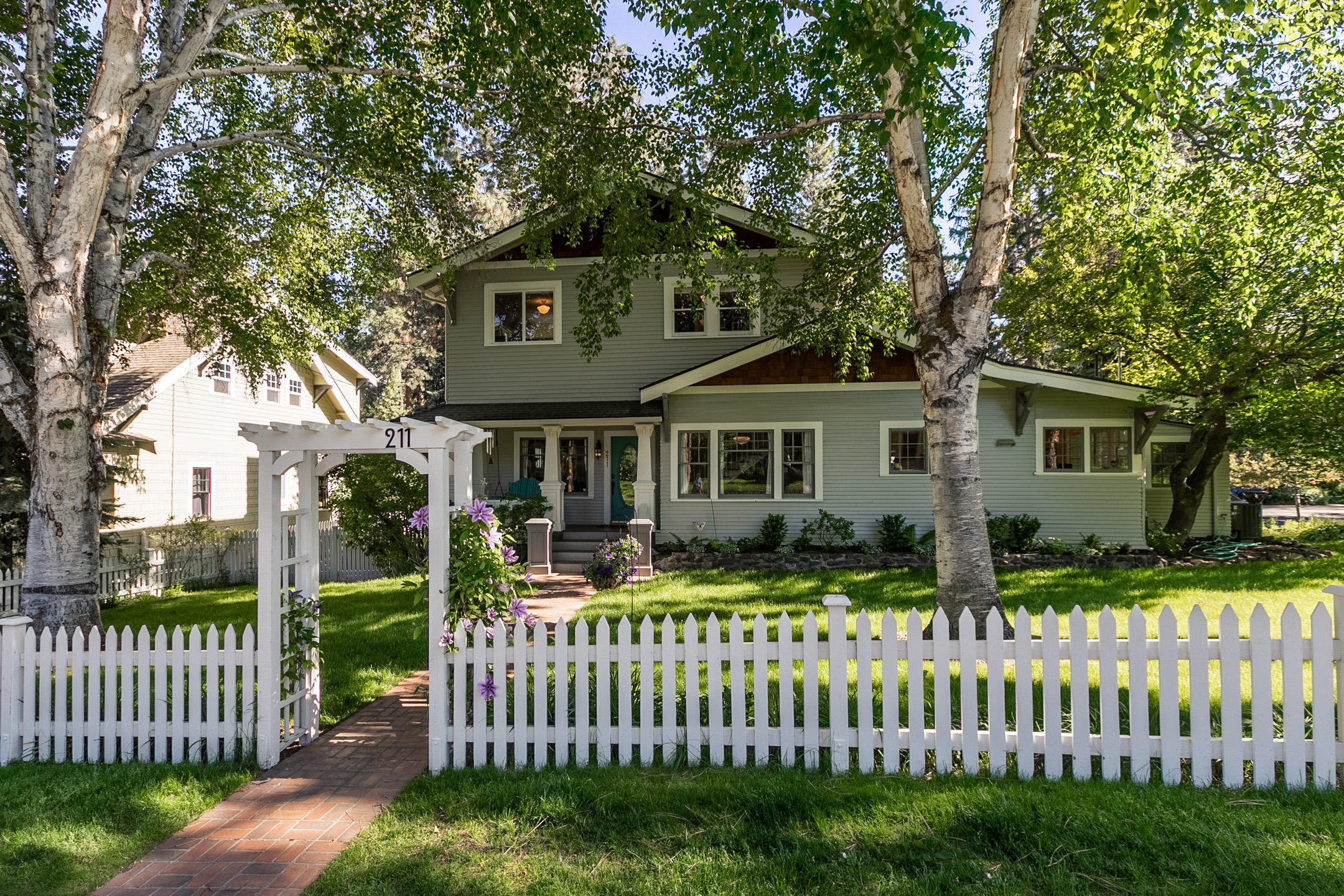 The passing of time brings never ending change, yet one thing remains constant and that is the importance of home! Enjoy glimpses of the past with heritage architecture while satisfying the need for modern luxuries. Undeniable curb appeal and character await. Hardwood floors grace the main level that highlights a restyled kitchen with painted wood cabinetry, quartz counters, marble backsplash, & pro-grade Thermador range. Main level primary suite features rear patio access, office nook, walk-in closet, & stunning marble bathroom. Cheery upper bedrooms include a signature Tahoe room. The beautifully finished basement houses laundry & bonus space for yoga or crafting. A Walk Score of 82 and Bike Score of 92 make this the ultimate park & walk location!  Dining, shopping, entertainment, & all of Downtown Bend are a 7minute stroll or 1minute e-bike ride away! Gourmet groceries at Newport Avenue Market, vibrant NW Galveston corridor, & water access for your kayak/SUP are just blocks away.