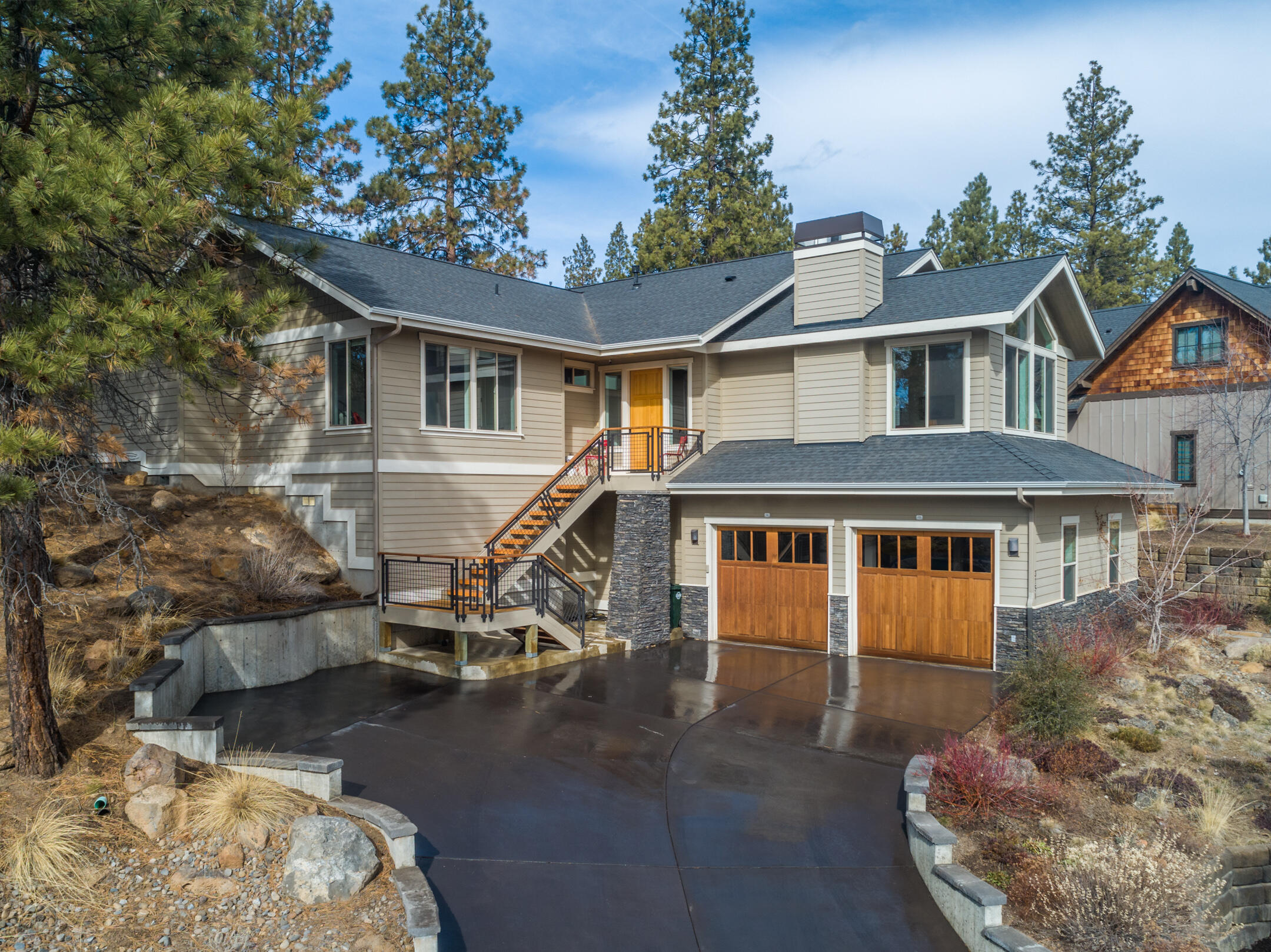 Perched on the hillside among towering pines, this Shevlin Ridge custom home offers privacy & views in a warm and light main floor living plan. The home offers a great-room concept where family & guests enjoy the openness of 9' ceilings & gracious 8' doors. The chef's kitchen w/SS appliances & gas cooktop serves as the hub where everyone will want to congregate at the vast granite bar. Both living & family rooms offer the warmth of gas fireplaces; dining & living room both offer territorial views.  Luxurious MBR suite w/ double vanities, jetted tub, glass & tile shower, plus additional 3 spacious guest rooms. Central A/C, garage w/workshop area & ample storage for all the toys you need to enjoy the Bend lifestyle. This home offers an easy-to-care-for xeriscape and natural landscape, w/a backyard patio featuring room for BBQ, dining and  fire pit just out of the family room and MBR. Shevlin Ridge is one of Bend's finest neighborhoods w/out expensive HOA dues, just 5 min. to downtown.