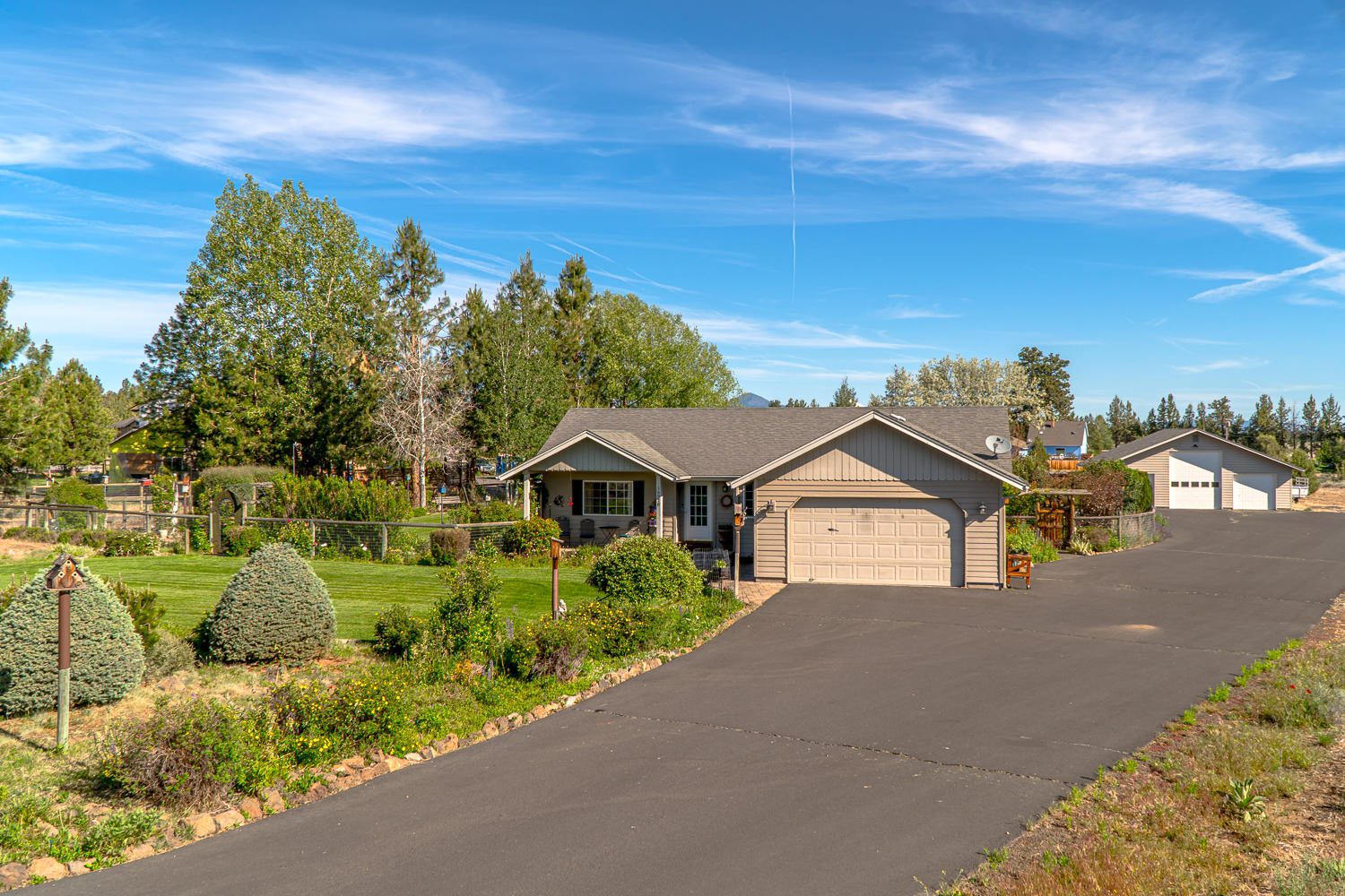 Desirable small acreage, single level home and a shop!  What else could one want?! Oh and mountain views!  Bend address, Sisters school district.  Convenient quiet location between Bend & Sisters.  Near National Forests.  Beautifully maintained home and property.  The yard is fenced with lovely gardens, a gardening shed (12'x16') & greenhouse (6'x8').  The 36'X36' shop has concrete floors, is insulated. 3 bays, one with a 12' door, the other two have 8' doors.  One bay has an office/man cave with heat.  This Super Good Cents 1488 sq ft home offers a cozy certified wood stove, 3 beds, 2 baths and extra long attached double garage.  Paved driveway and 2- 220 plug ins for RVs next to the shop.