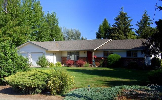 Country feel on Apollo Road. A homey presentation welcomes you into this 3 bed, 2 bath, 1726sf single level home. Living room and family room w/slider to large patio/deck and large utility w/sink. Updates include newer appliances, windows and flooring. Enjoy the beautiful landscaped outdoor living area, 1 acre fenced, irrigated pasture w/semi solid set lines. Room for animals and toys. Just minutes to town from this immaculate single level home. Tired of being squeezed? This home is move in ready!