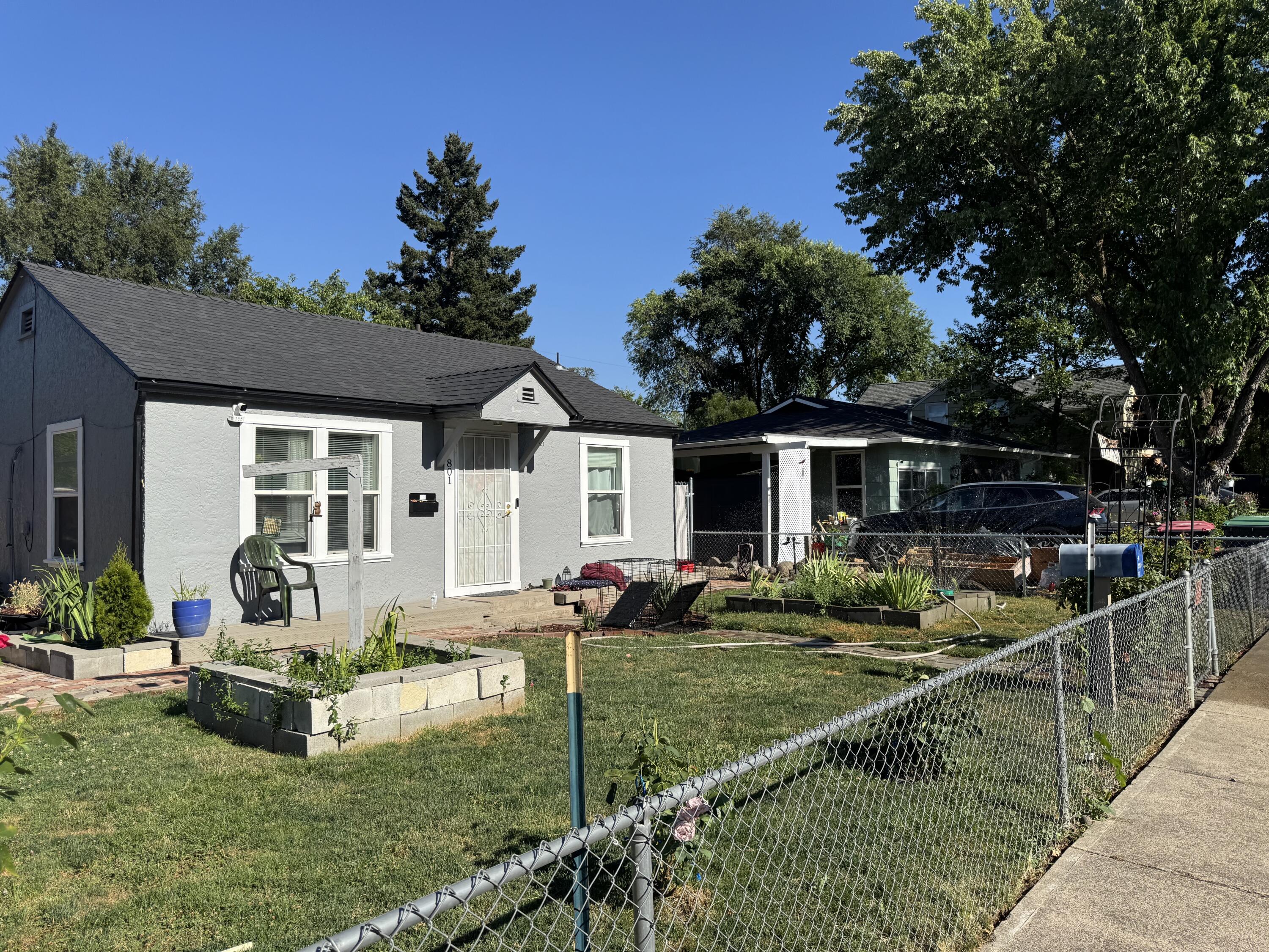 Recently updated home on corner lot with a BIG backyard, cute front yard and fully fenced. 2 bedrooms and 1 full bath with dining area, full laundry room, and efficient ductless HVAC system to keep you comfortable year round. Backyard has developed raised garden beds and shady tree. Bus routes, grocery store and other community amenities are just blocks away. Backyard is being tidied up. Don't miss seeing this affordable home with many possibilities!