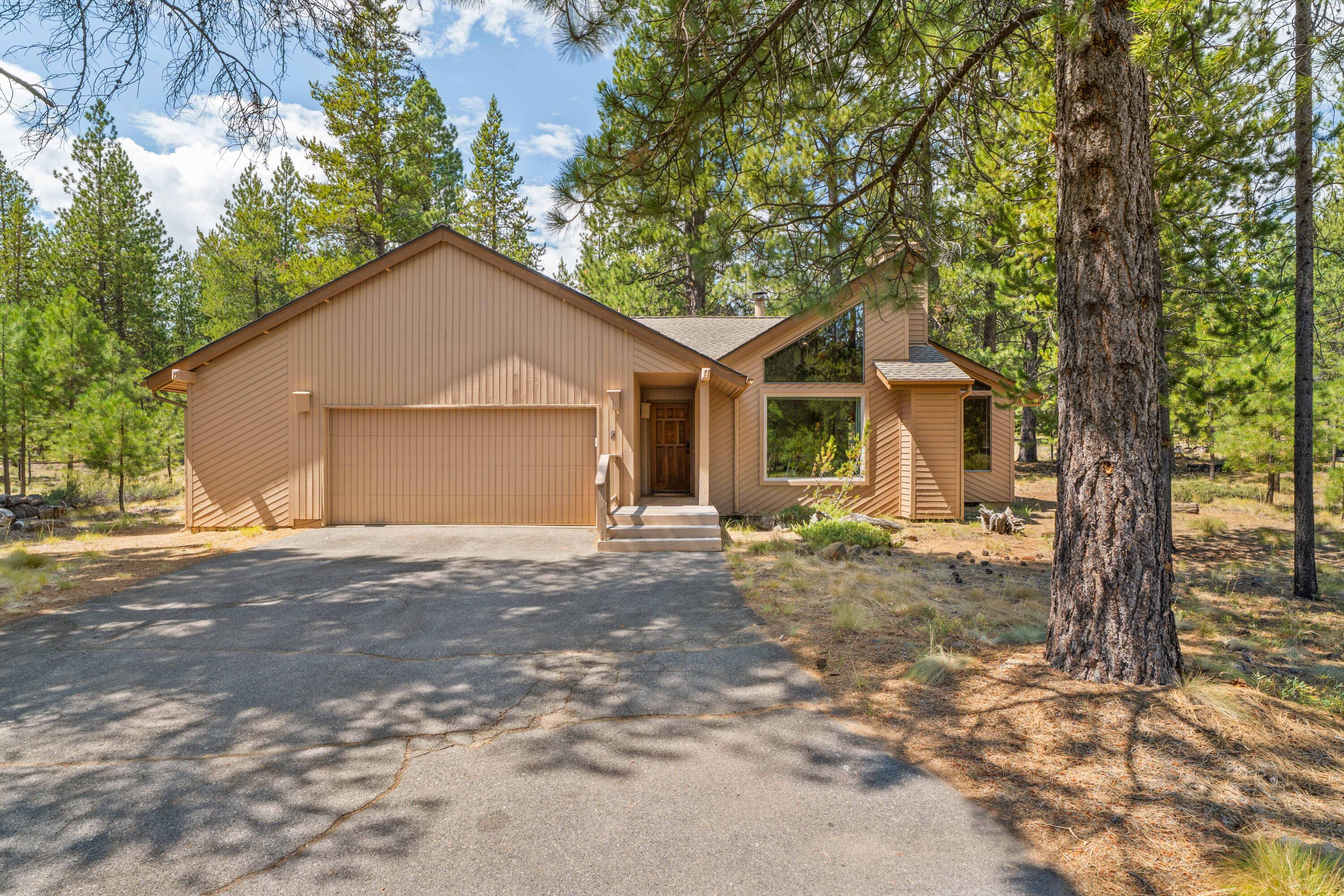 Cherished Sunriver Retreat Backing to Over 15 Acres of Common Space. Offered for the first time in 37 years, this beloved family retreat has been the backdrop for generations of memories. Perfectly positioned in one of Sunriver's rarest locations—backing to a serene, forested expanse of over 15 acres of common space—this home offers a peaceful setting just moments from The Village, SHARC, Fort Rock Park, & the bike path. Inside, you'll find the warm charm of vaulted cedar ceilings & two nostalgic lava rock wood-burning fireplaces—one in the living room & another in the family room—perfect for cozy evenings after a day of adventure. With 3 bedrooms & two spacious living areas, there's plenty of room to gather & unwind. Step outside to a generous deck w/ hot tub, a private dog run, and space to enjoy the outdoors year-round. Move-in ready with A/C, exterior paint refreshed in 2022, newer hot water heater (2021), & SHARC paid in full. A GEM waiting for its next chapter!