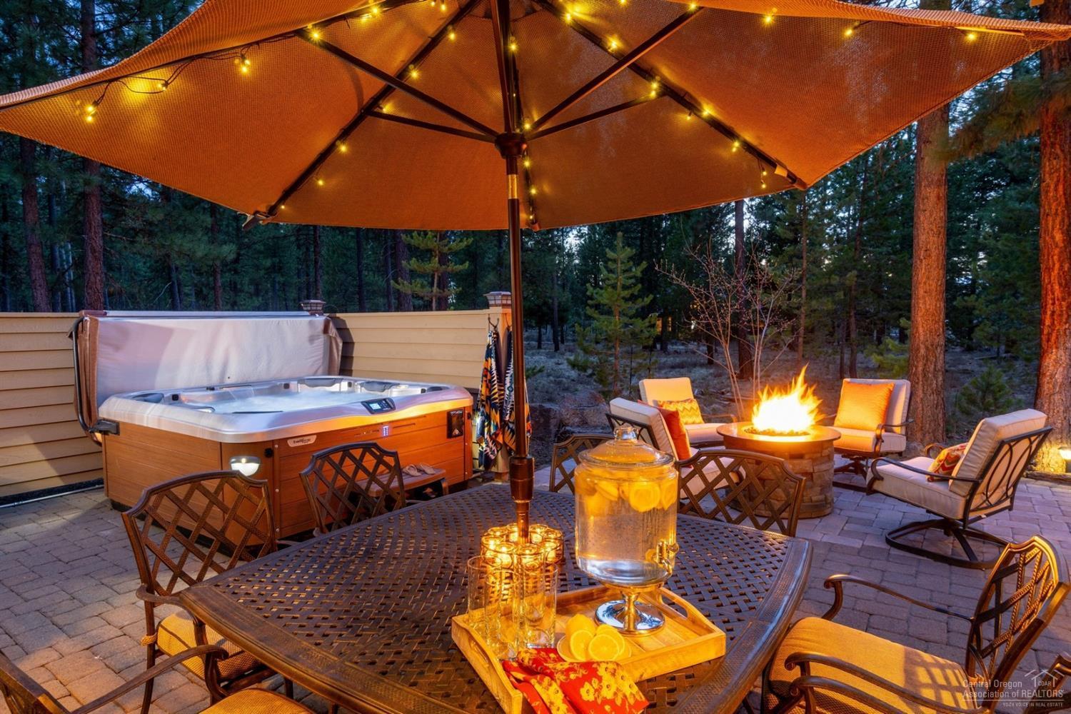 Privacy and luxury await at this premier residence in highly sought-after Caldera Springs Resort. Steps from fly fishing at Fireglass Lake, and hiking, kayaking and cycling. Enjoy blue skies while listening to gentle breezes through the Ponderosa pines of this serene retreat. Quality craftsmanship and high-end finishes throughout with stunning architectural elements including soaring ceilings, gleaming hardwoods, and extensive stone and rock. Designer furniture package invites conversation indoors and out. Beautifully appointed 3,536 sq. ft. of separated living spaces with 4-generously sized master suites, 4.5 baths, office, and spacious bonus/bunk room with endless possibilities. Gourmet kitchen has both eat-in and formal dining areas with open integration for entertaining. The expansive patio with fire pit, covered/heated BBQ kitchen, and hot tub, ensure the outdoor living space is perfect for relaxing after a day of Central Oregon adventure. Your Caldera Springs legacy awaits!