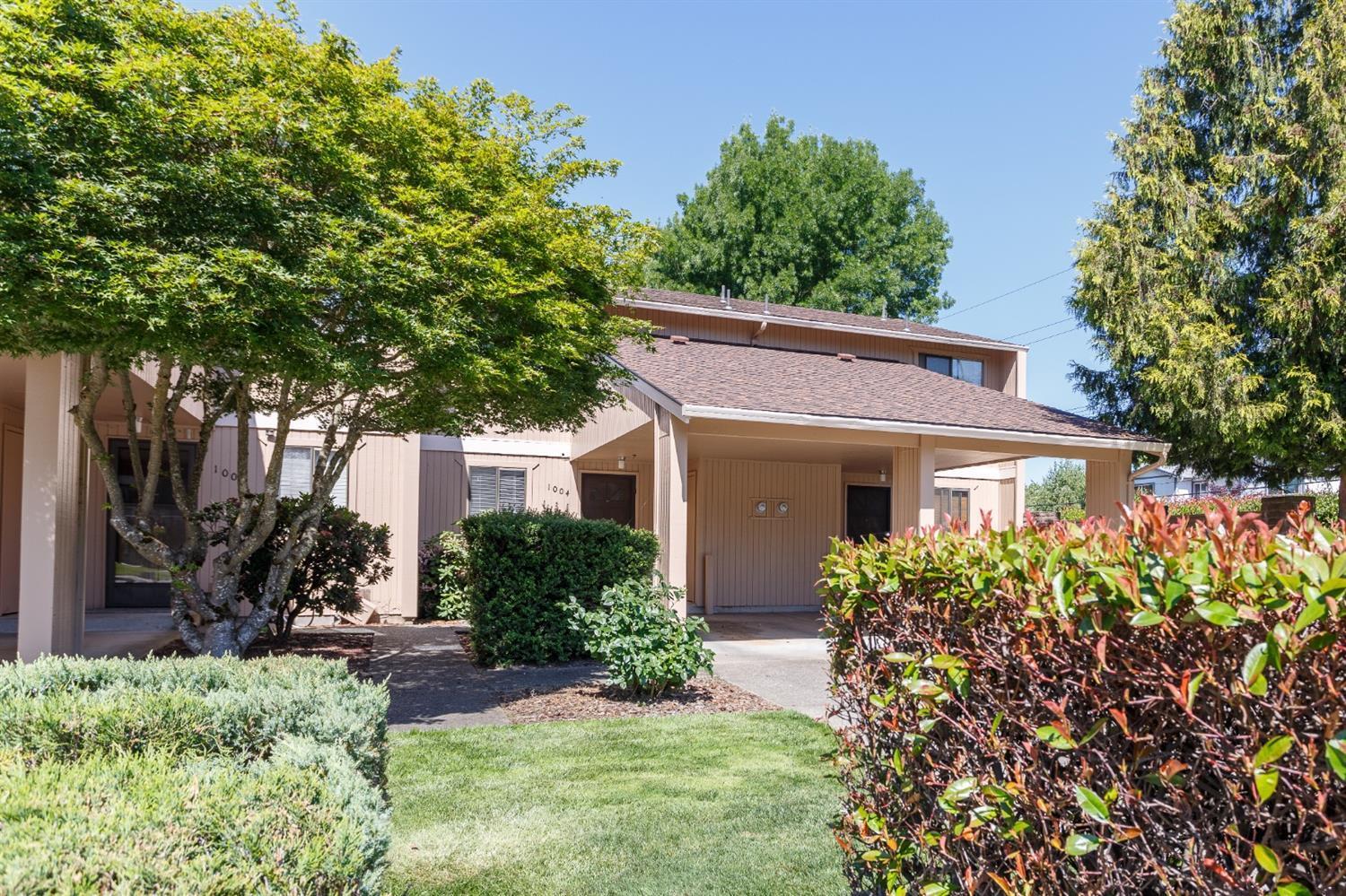 Turn-key Condominium in Leisure Estates! Welcome to 1004 SE Camelot Drive—an updated 952 sq ft gem in the heart of Grants Pass. This charming 2-bedroom, 1.5-bath home features brand-new LVP flooring on the main level and plush carpeting upstairs. Fresh interior paint gives every room a crisp, modern feel. The flow-through kitchen shines with new appliances including range/oven, refrigerator, and dishwasher. An included washer and dryer add convenience and value. Plus, additional ample storage space to ensure your belongings stay organized and out of sight. Located in a quiet, well-maintained community close to shopping, parks, and medical services. Whether you're a first-time buyer, downsizing, or investing, this move-in-ready home offers comfort, style, and low-maintenance living.
