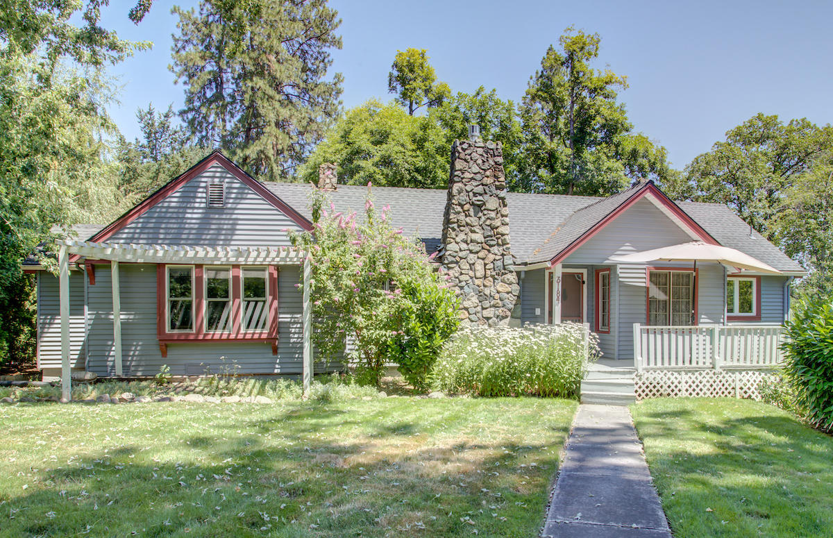 Imagine yourself living in this 1 Acre estate that has been lovingly preserved and updated.  Room for your RV, and the oversized 780 S.F. detached insulated garage/Shop.  1457 S.F. Main Floor and a finished daylight basement with 955 S.F.  of useable space including a ½ bath, game-room and hobby-room.  Plenty of charm and character to go around.  Property has a stream running through it with two footbridges to access the fantastic landscaping this fully fenced park-like home has to offer.  There is plenty of room on the main floor with a tall ceiling great room and a 2 year old gas fireplace insert.  A formal dining room right next to the updated kitchen including a convection oven, new refrigerator, and stone countertops.  This home boasts a huge composite deck that wraps around most of the home.  The property has been electrically updated to code.   The HVAC system is geo-thermal for fantastic efficiency in both winter and summer.  Come get your Oregon Dream home today.