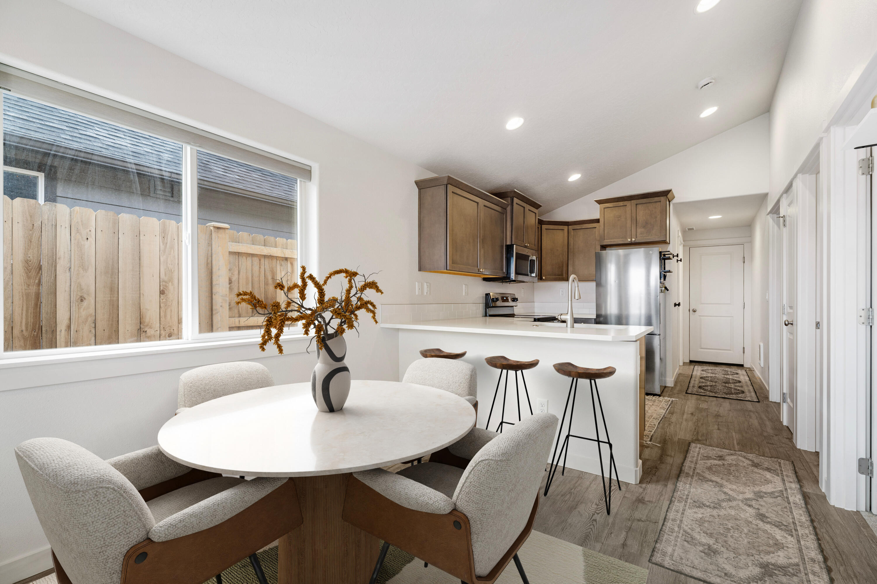 Built in 2023, this modern home lives like new: efficient, easy to care for, and move-in ready. Currently the most affordable single-family home in Redmond, it's an ideal fit for anyone seeking a smart starter home, a comfortable downsizing option, or an efficient footprint in a prime location. Enjoy fenced front and side yards that are simple to maintain yet offers space to make your own. Community garden sits across the way, adding a pleasant view, instead of facing a neighbor's house. Inside, you'll find a smart layout with contemporary finishes. Includes alley access & 2 car garage, ductless electric heating and cooling, and energy-conscious construction. Less than ten minutes from Smith Rock, .2 miles from Elton Gregory Middle School, Tom Mccall Elementary School, and direct access to 97 (Via Upas). Located in Redmond's desirable Cinder Butte Village, you'll love being close to trail systems and parks—with some of the most impressive local mountain views on your drive home!
