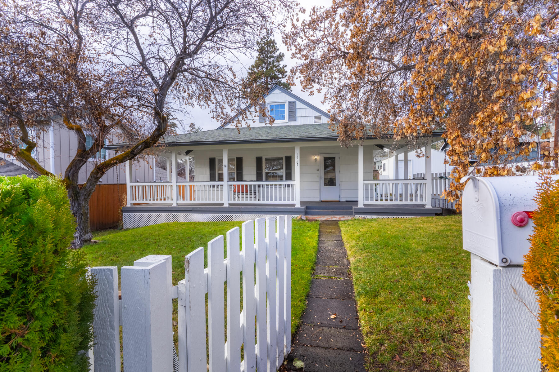 Dreaming of life in Bend where you can ski in the morning, paddle in the afternoon, and walk to sushi at night? This classic  millworker bungalow delivers all that and more. Located in the heart of downtown, you're just blocks from the Deschutes River, Newport Market, Spork, coffee shops, food trucks, parks, and summer concerts. Mt. Bachelor is just a 20-minute drive for world-class snow days. Inside, enjoy vintage charm with modern updates throughout. The rare basement with its own entrance offers prime potential for a rental, guest suite, studio, or gear room—there's even space for a kitchen and dining area. RM zoning opens the door for future multi-family use or creative expansion. With a welcoming wrap-around porch, walkable lifestyle, and move-in-ready condition, this home is ideal for those who crave outdoor adventure, community vibes, and long-term flexibility. Live simply, play hard, and invest smart—right in the heart of Bend.